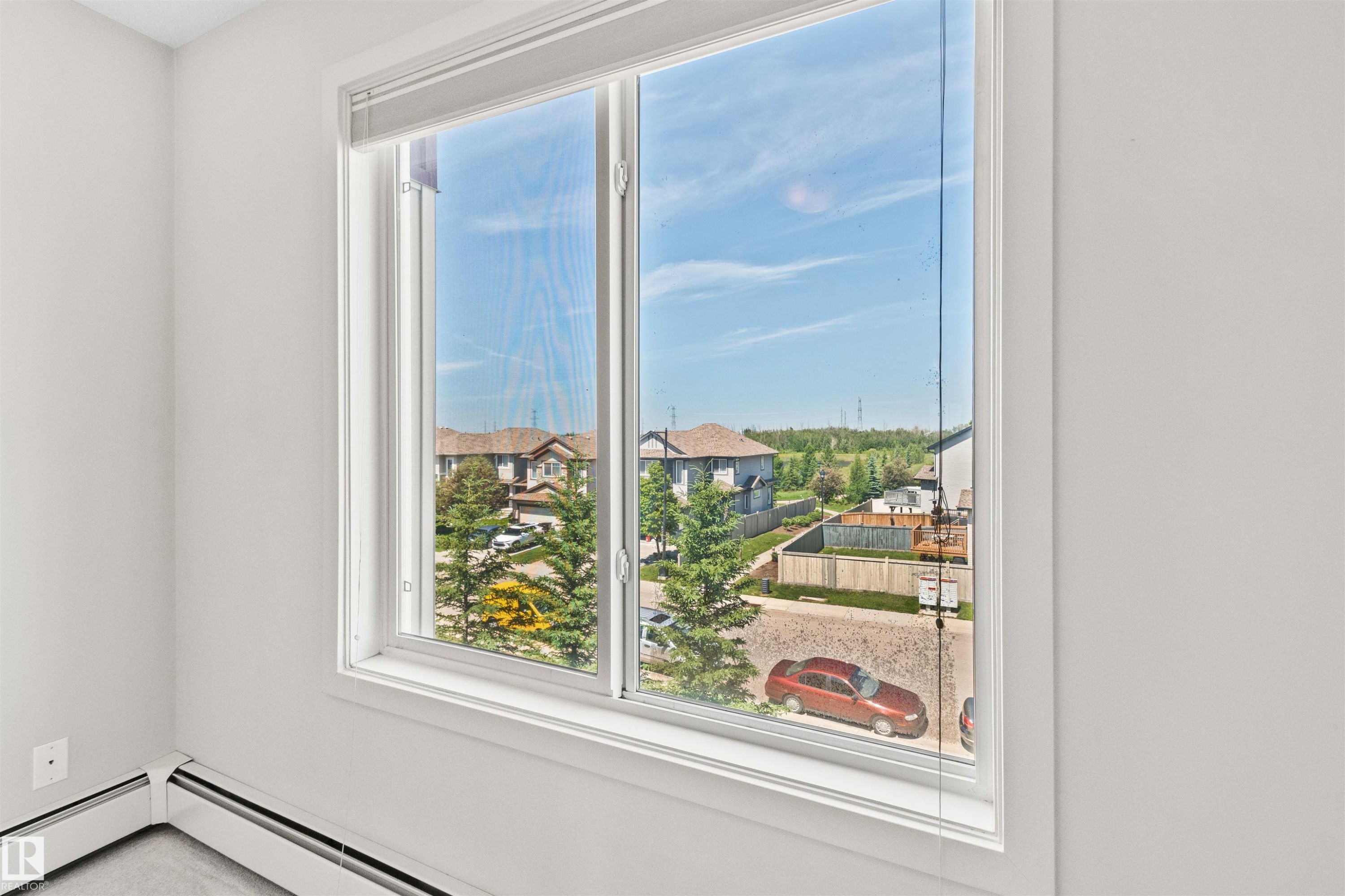 White window frame with a multi-pane design - #318 5521 7 Av Sw Sw, Edmonton, AB - Indoor Photo Showing Other Room