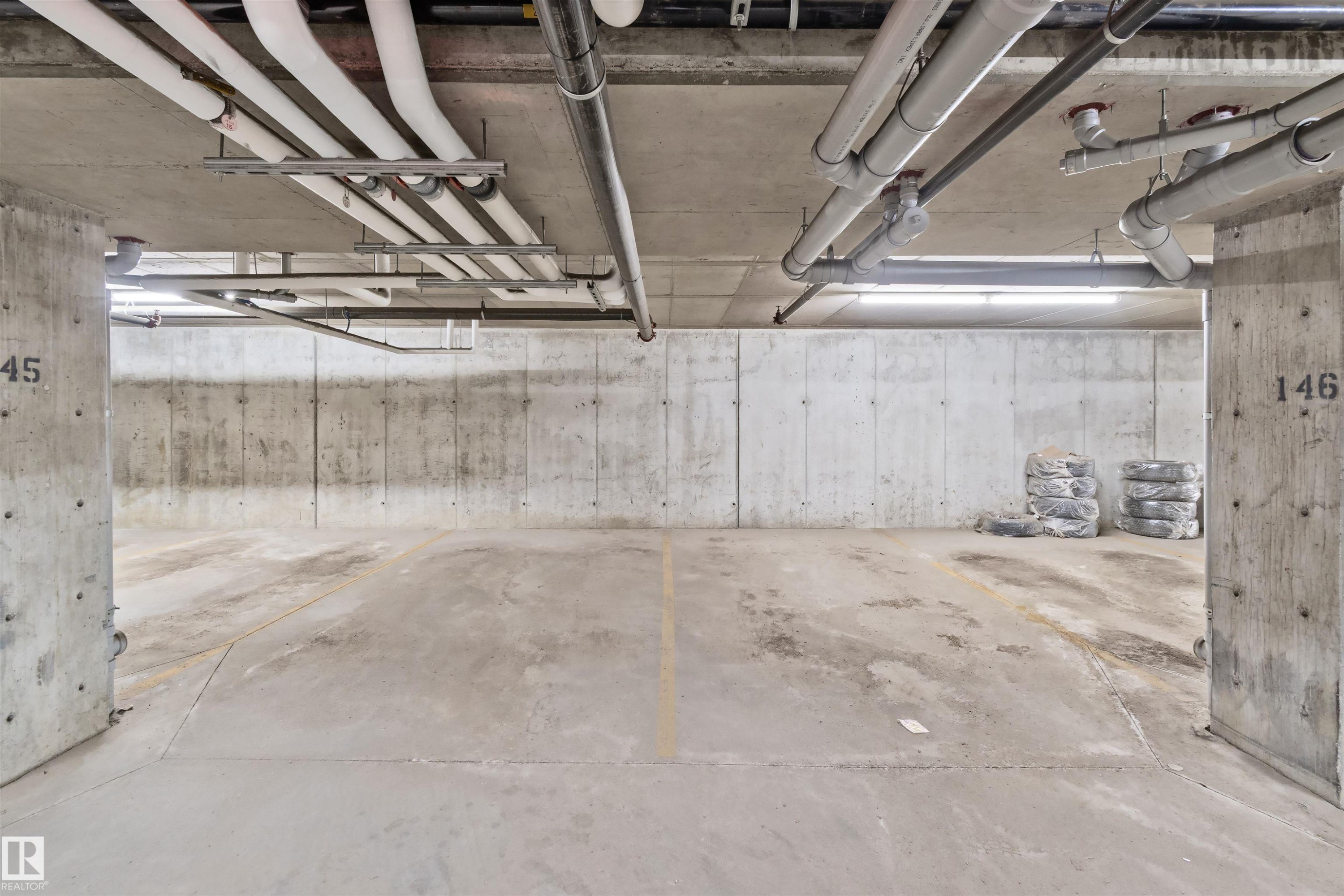 Underground parking stalls - #318 5521 7 Av Sw Sw, Edmonton, AB - Indoor Photo Showing Garage