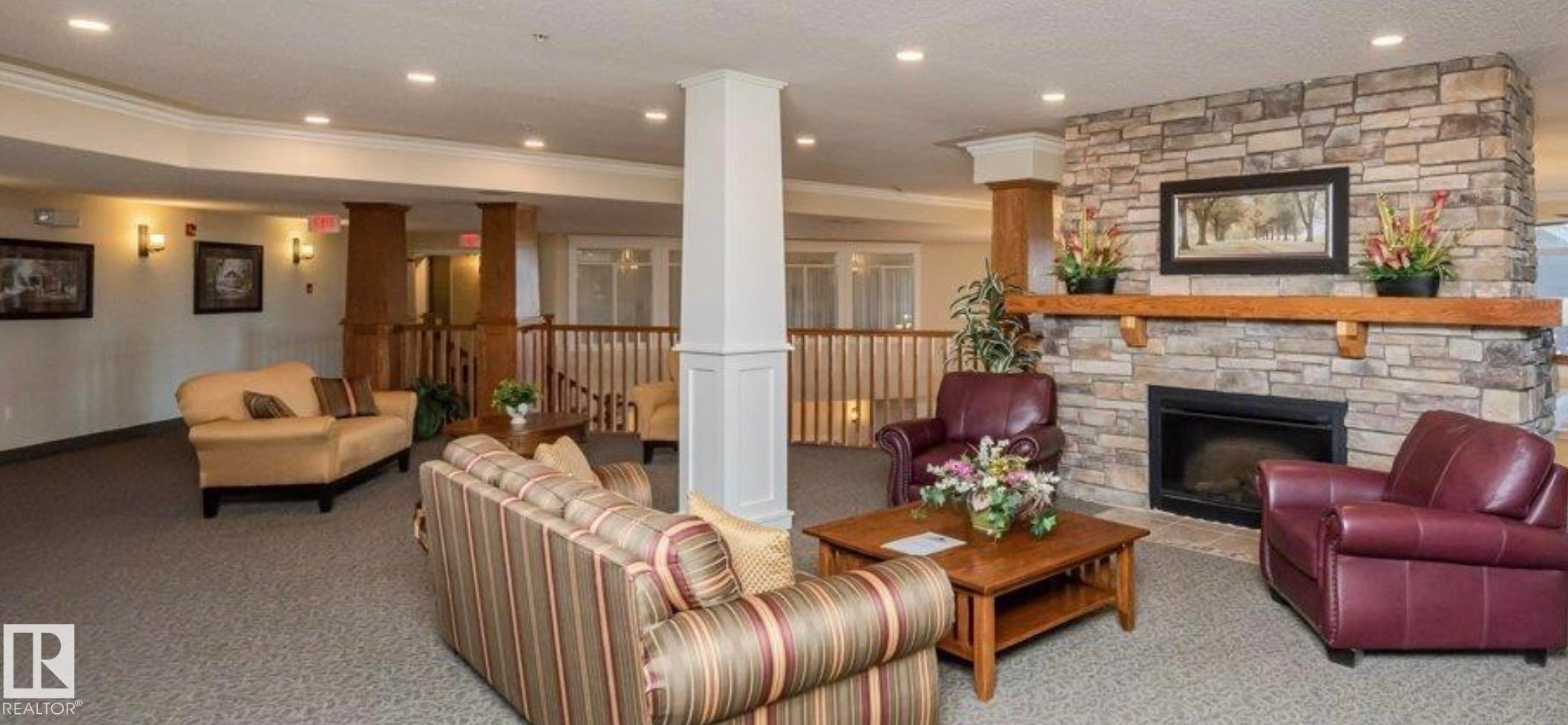 #313 511 Queen St, Spruce Grove, AB - Indoor Photo Showing Living Room With Fireplace