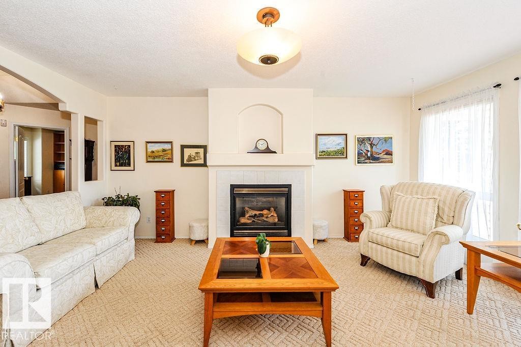 4720 51 Street, Camrose, AB - Indoor Photo Showing Living Room With Fireplace