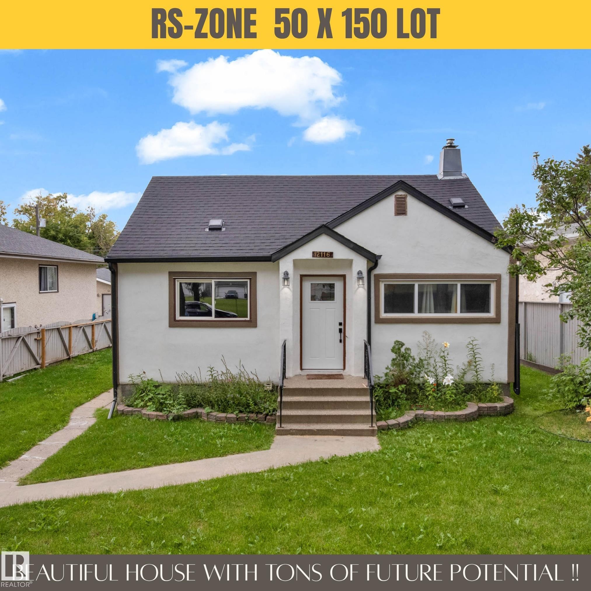 White exterior with dark trim accents, front steps leading to an entry, and a dark shingle roof - 12116 81 Street Nw, Edmonton, AB