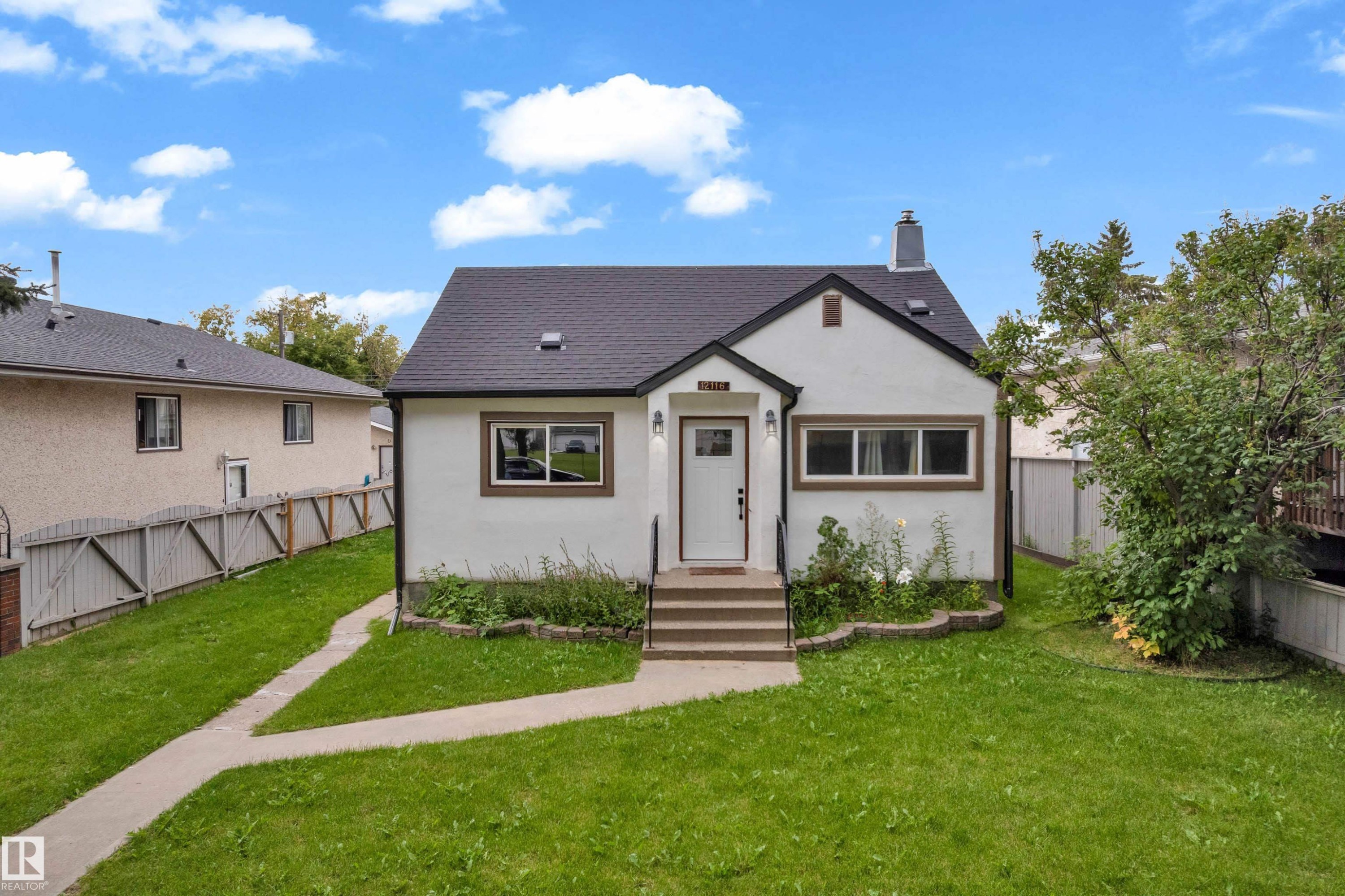 White stucco exterior with dark trim accents - 12116 81 Street Nw, Edmonton, AB