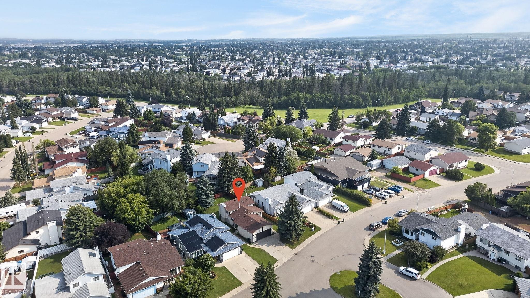Aerial perspective of a residential neighborhood featuring established homes with varying rooflines and mature trees - 3722 34A Avenue Nw, Edmonton, AB - Outdoor With View
