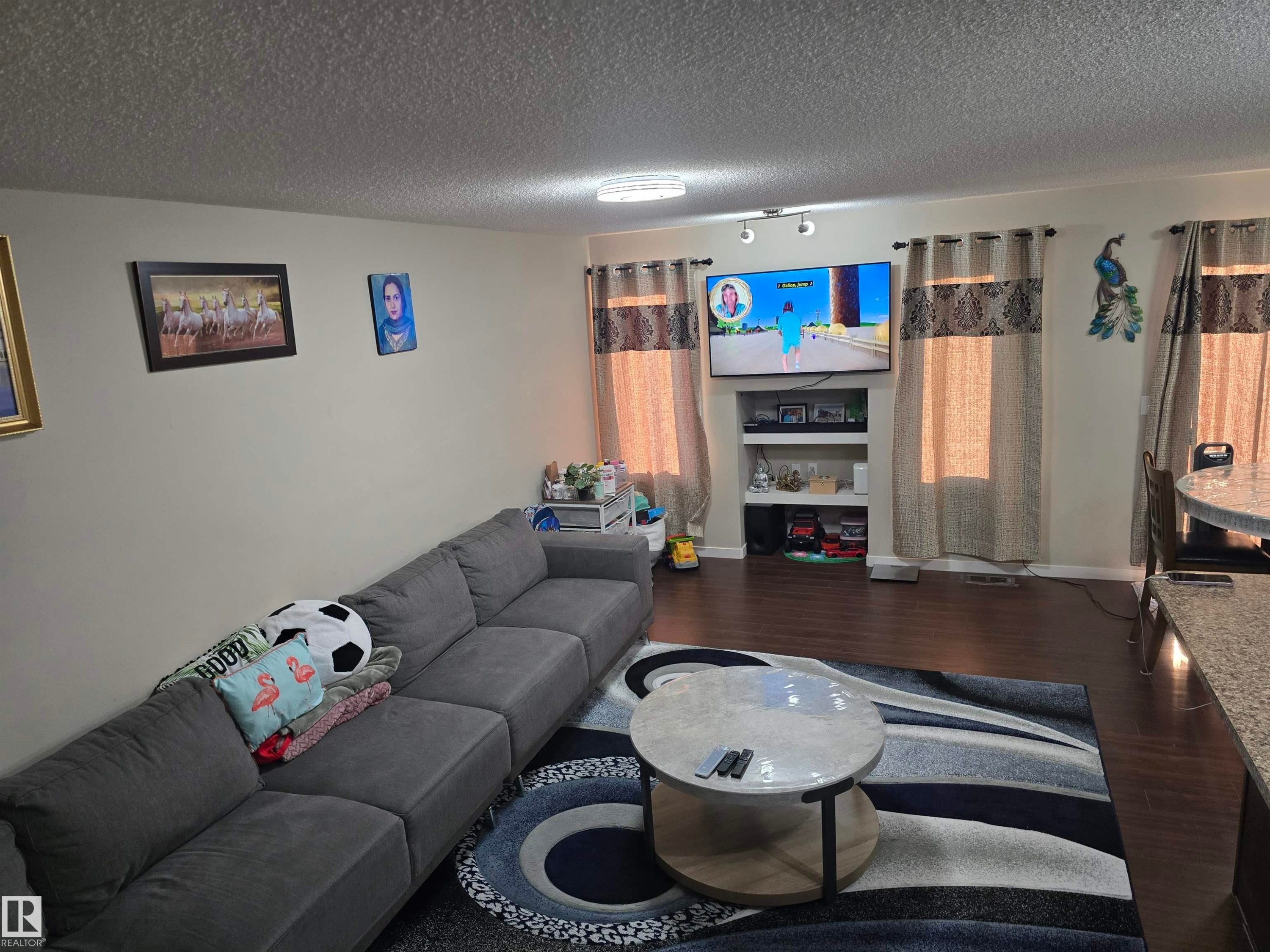 Hardwood-style flooring throughout - 1474 33B Street Nw, Edmonton, AB