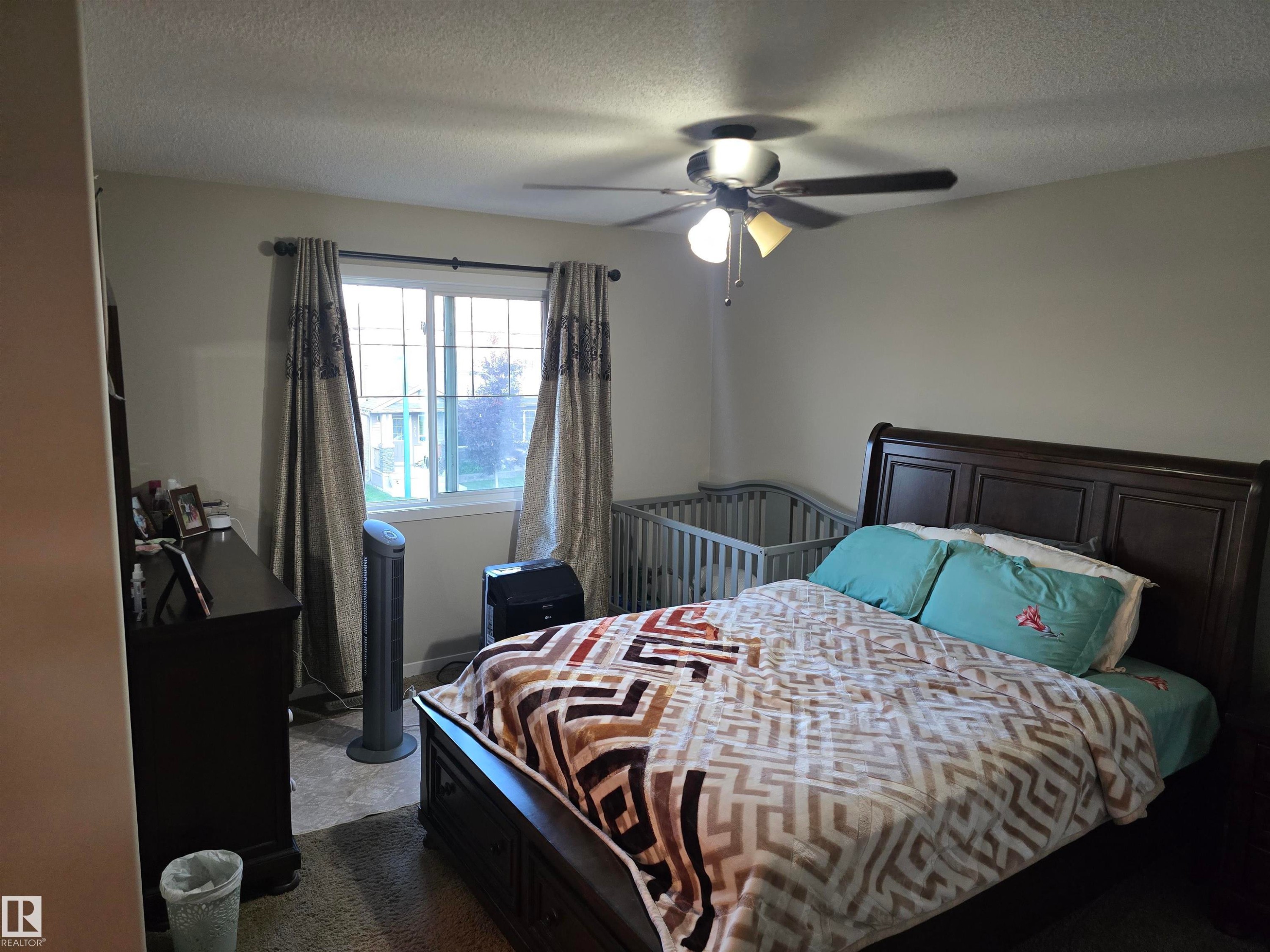 Window with white trim - 1474 33B Street Nw, Edmonton, AB