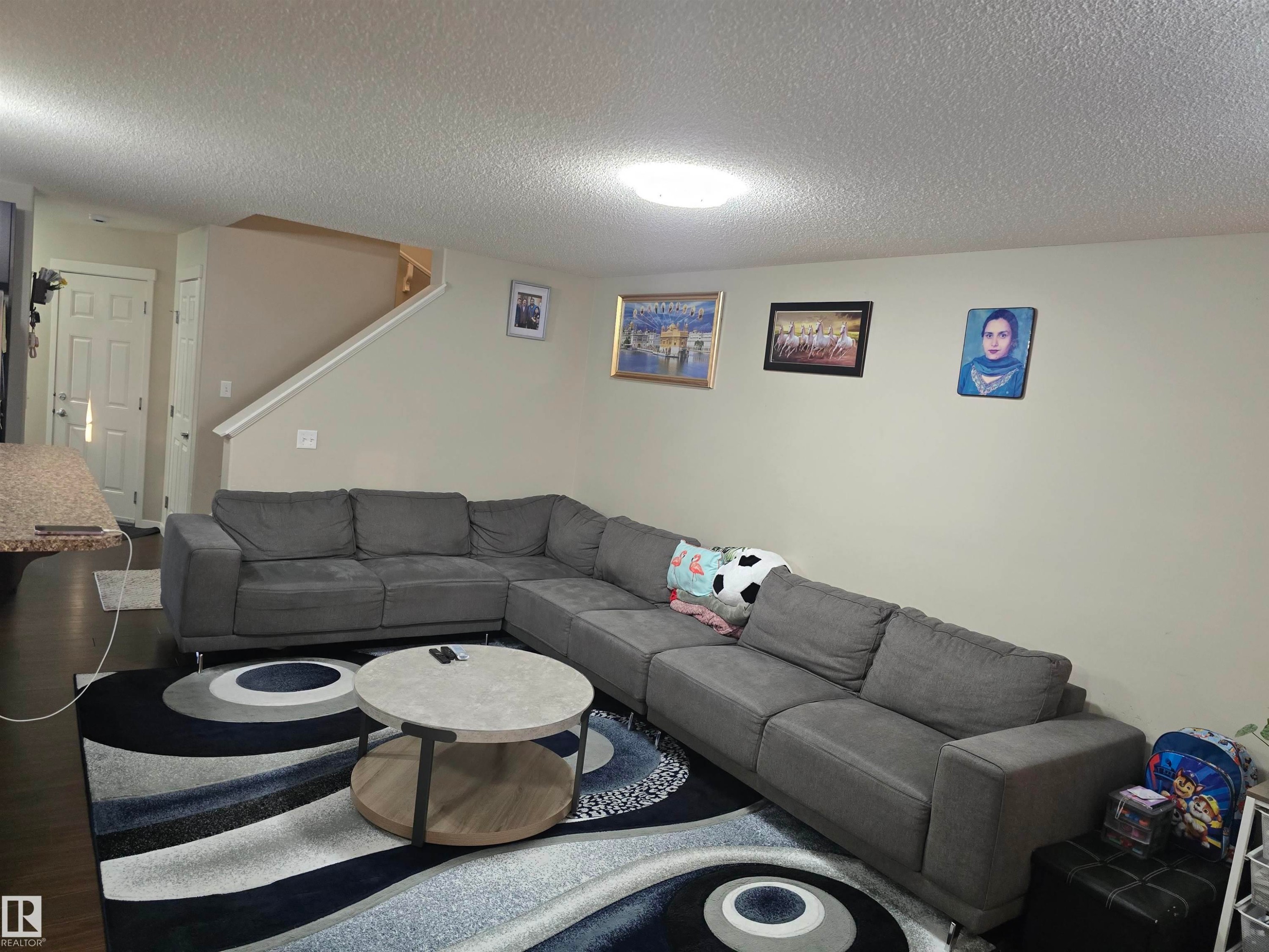 Recessed lighting, wood-finish flooring, and light-toned walls - 1474 33B Street Nw, Edmonton, AB
