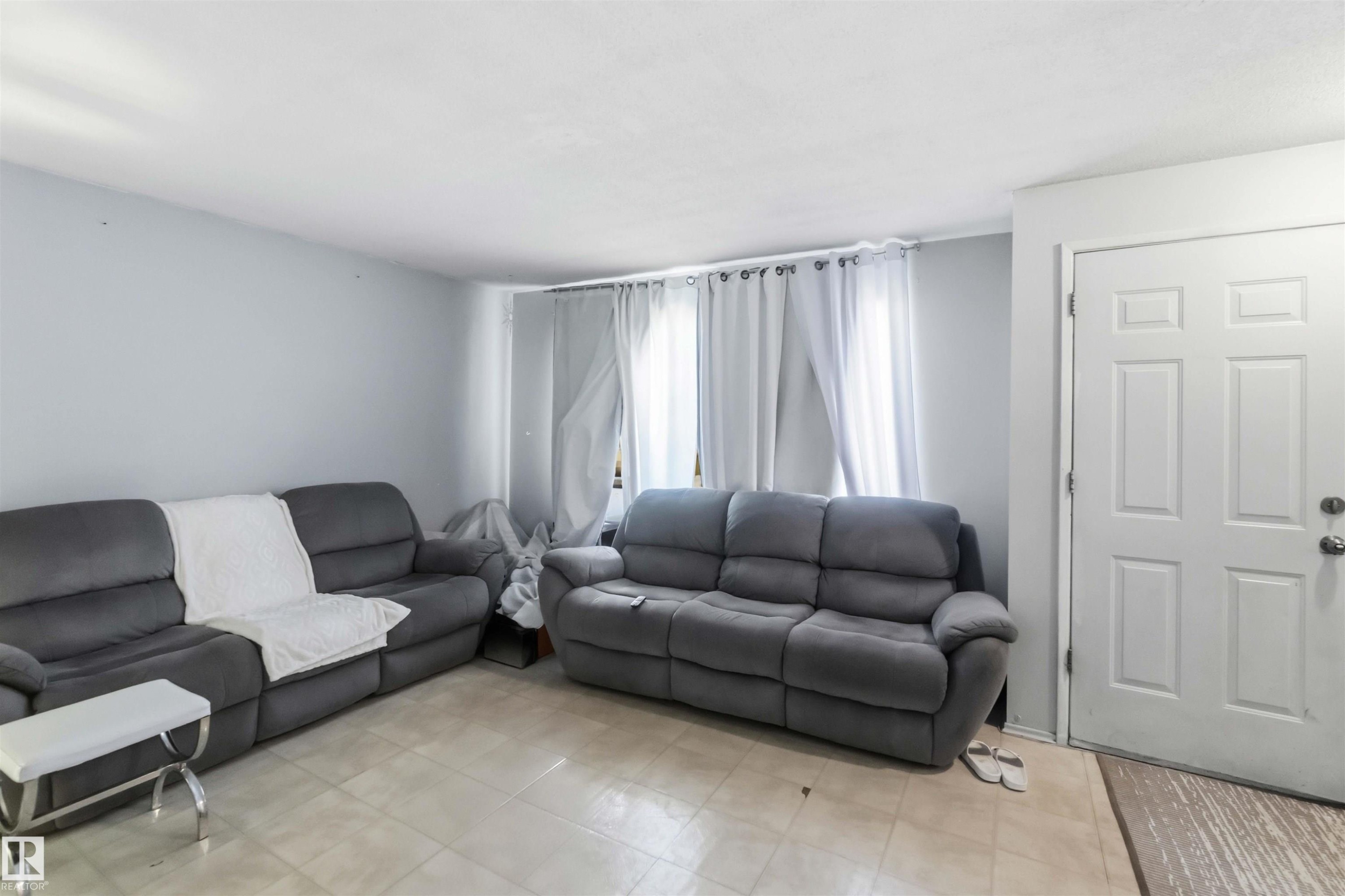 Light-toned tiled flooring extends across the space - 13408 67 Street Nw, Edmonton, AB