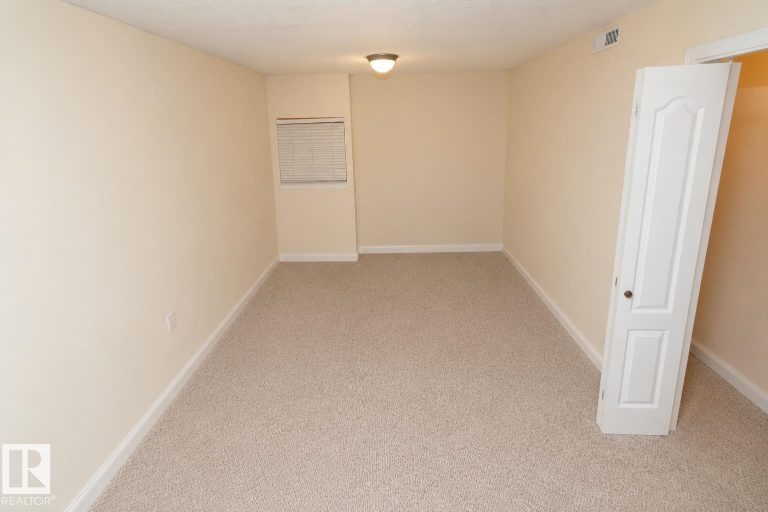 Neutral-toned carpeting throughout - #37 3811 85 St Nw, Edmonton, AB