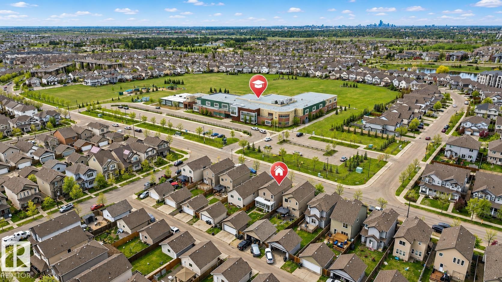 Residential neighborhood setting with tree-lined streets and varied housing styles - 445 Watt Boulevard Sw, Edmonton, AB