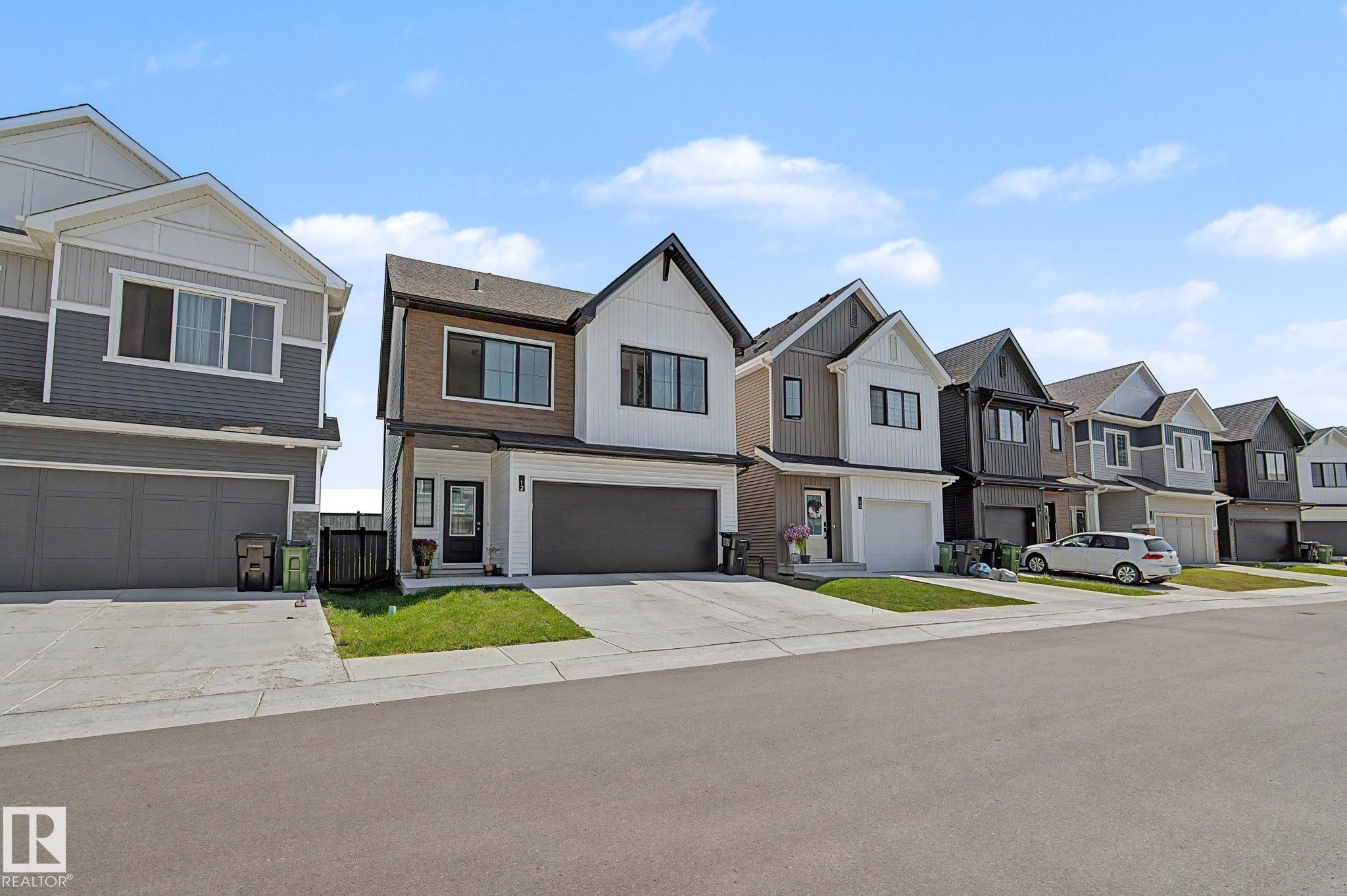 Contemporary two-story residence with a gabled roofline and a mix of horizontal siding and vertical accents - #12 905 172 St Sw, Edmonton, AB - Outdoor With Facade