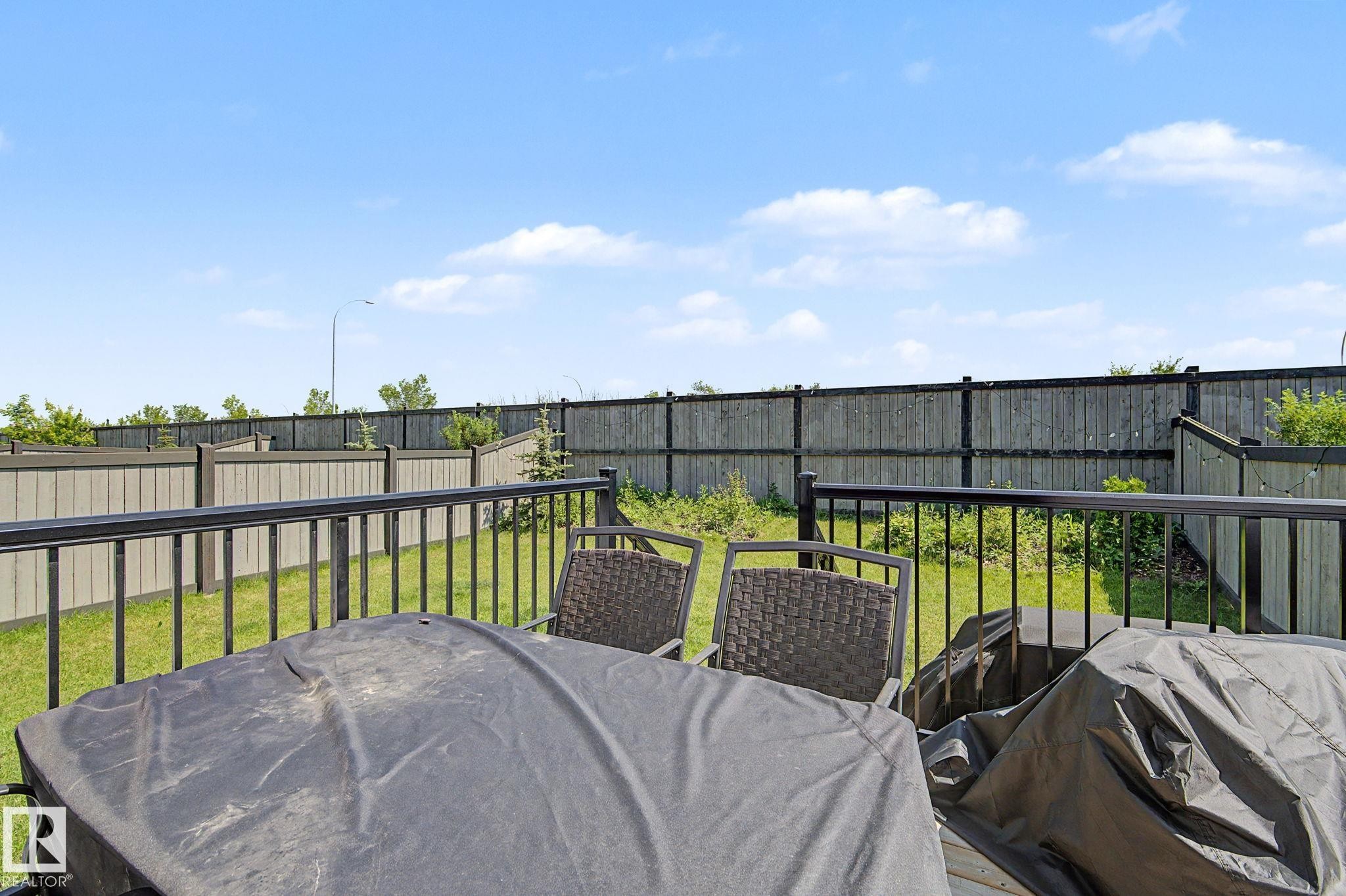 Expansive outdoor deck featuring black metal railings - #12 905 172 St Sw, Edmonton, AB - Outdoor