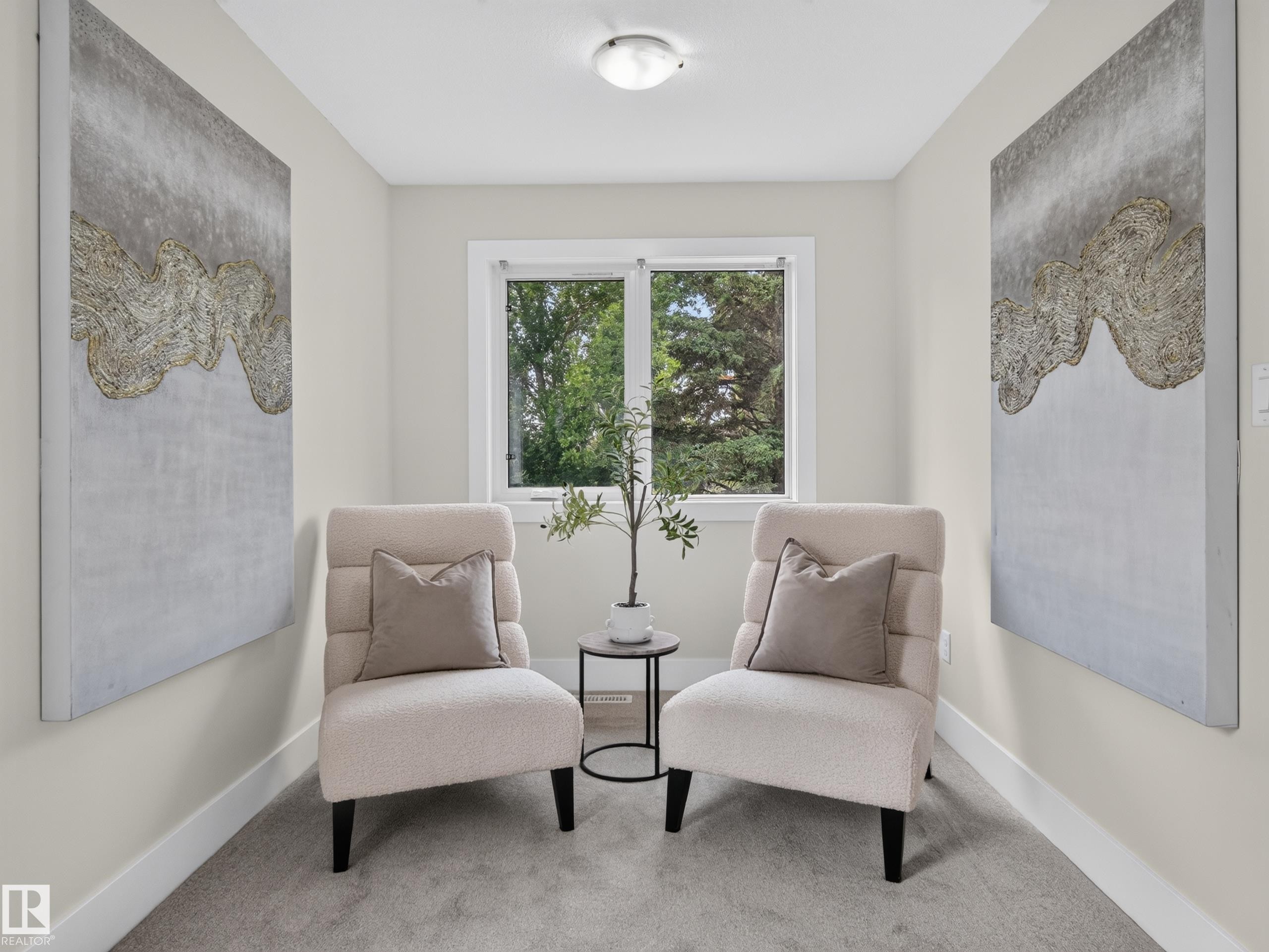 Recessed alcove featuring a window, light gray carpeting, and white baseboards - #59 10550 Ellerslie Rd Sw, Edmonton, AB - Indoor Photo Showing Other Room
