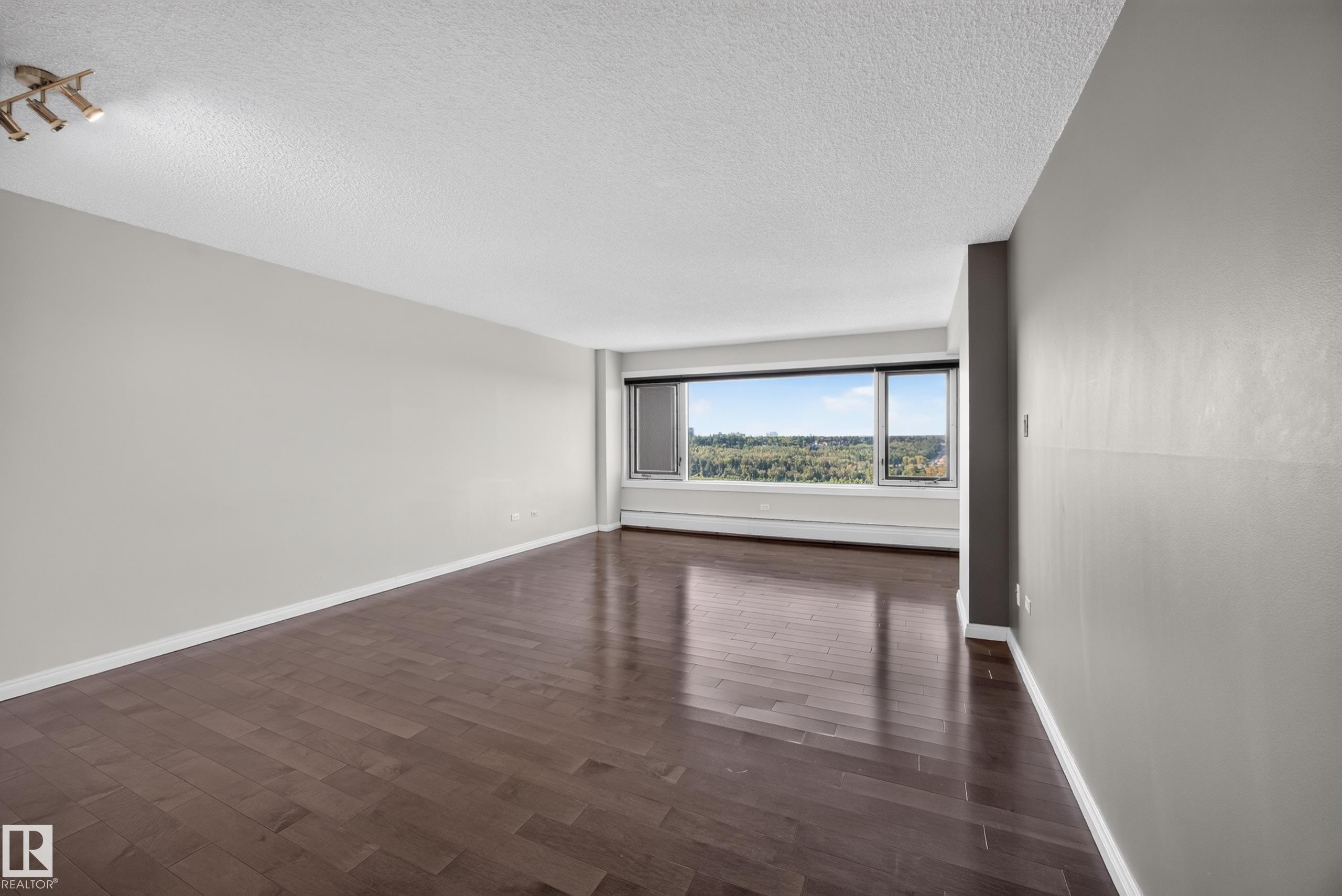 Large Living Room/Dining Room space with stunning south facing views of the River Valley and Victoria Golf Course. - #803 10011 123 St Nw, Edmonton, AB