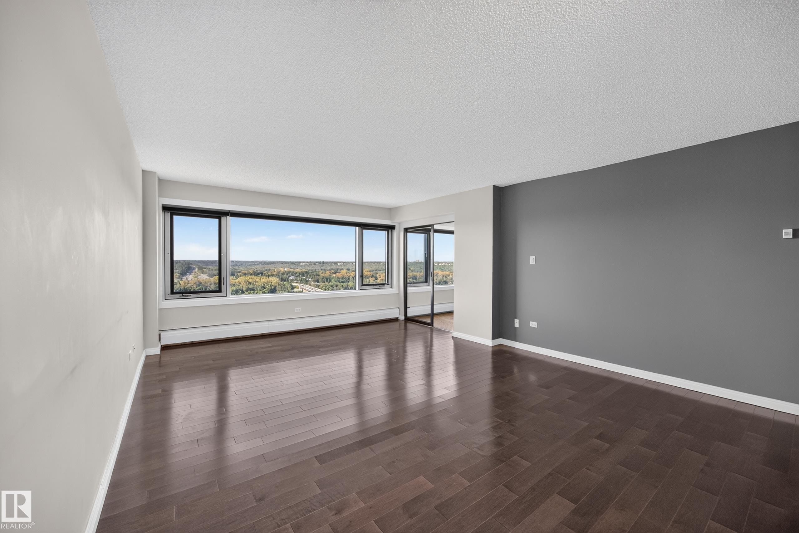 Large Living Room/Dining Room space with stunning south facing views of the River Valley and Victoria Golf Course. - #803 10011 123 St Nw, Edmonton, AB