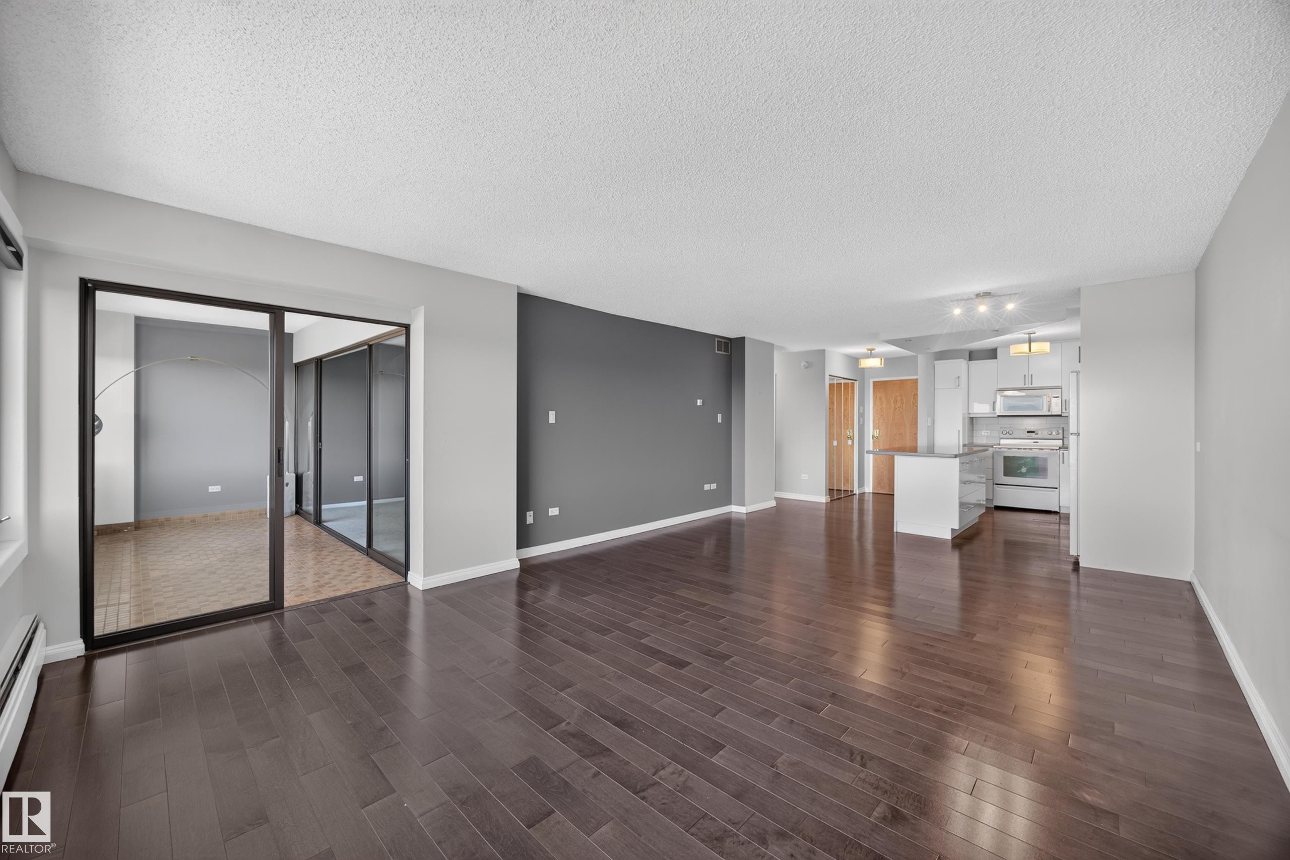 Large Living Room/Dining Room space with stunning south facing views of the River Valley and Victoria Golf Course. - #803 10011 123 St Nw, Edmonton, AB