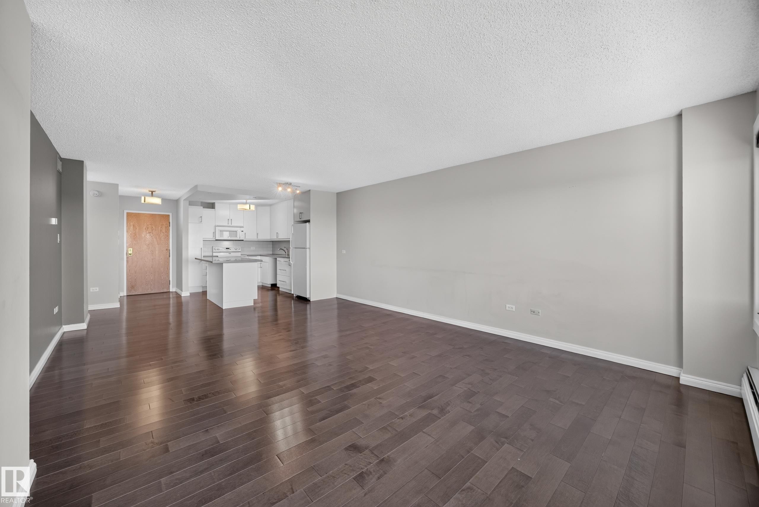 Large Living Room/Dining Room space with stunning south facing views of the River Valley and Victoria Golf Course. - #803 10011 123 St Nw, Edmonton, AB
