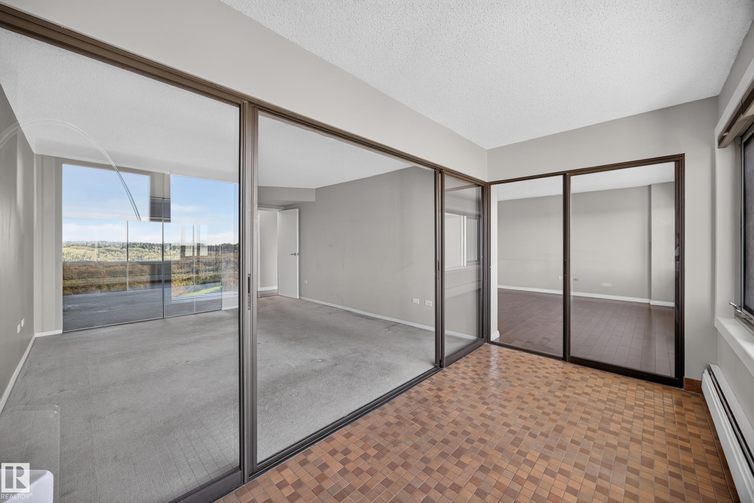 Flex space separated from the Living Room and Bedroom by glass sliding doors. Home office, library, or simply a stunning place to unwind. - #803 10011 123 St Nw, Edmonton, AB