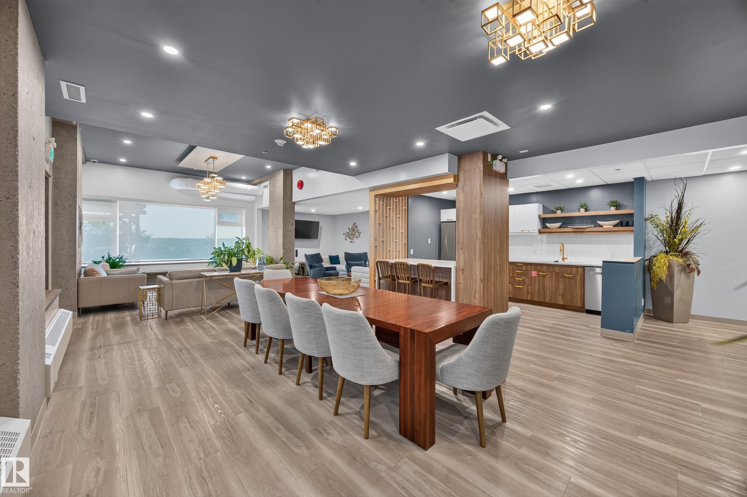Condo Building Social Room Space featuring Kitchen, Dining Room Space, Multiple Lounge Spaces, two Bathrooms, and access to outdoor common space. - #803 10011 123 St Nw, Edmonton, AB