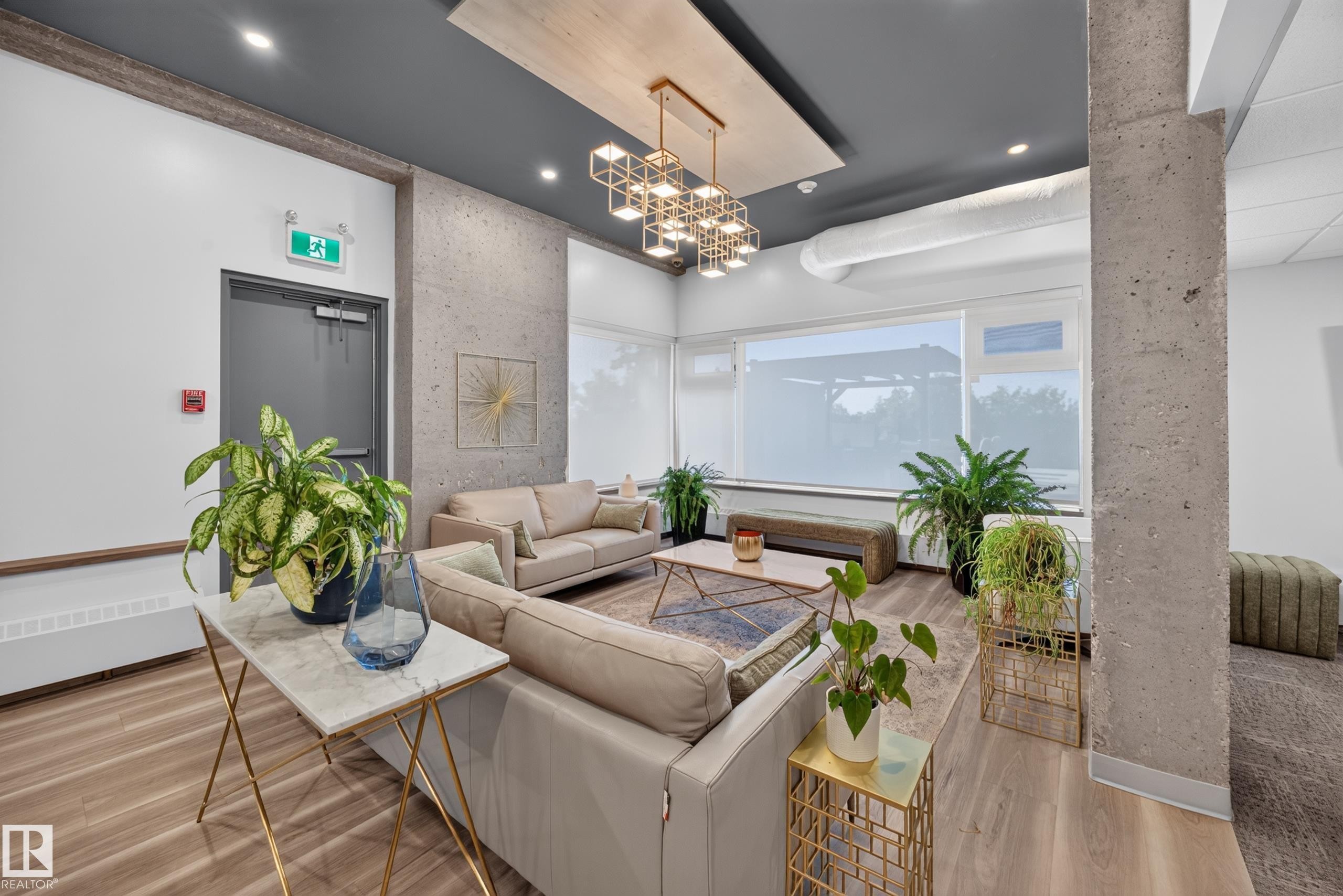 Condo Building Social Room Space featuring Kitchen, Dining Room Space, Multiple Lounge Spaces, two Bathrooms, and access to outdoor common space. - #803 10011 123 St Nw, Edmonton, AB