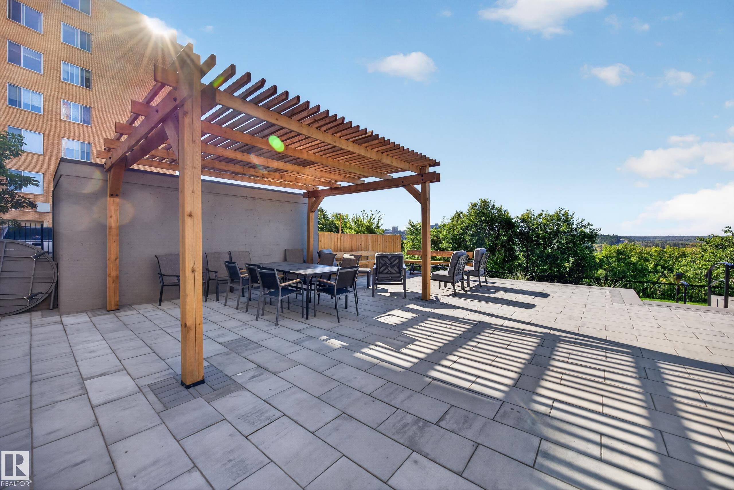 Condo Building Outdoor Common Space featuring Resident BBQ Area, Gazebo, Sitting Areas, Beautiful Landscaping, and Stunning River Valley views. - #803 10011 123 St Nw, Edmonton, AB