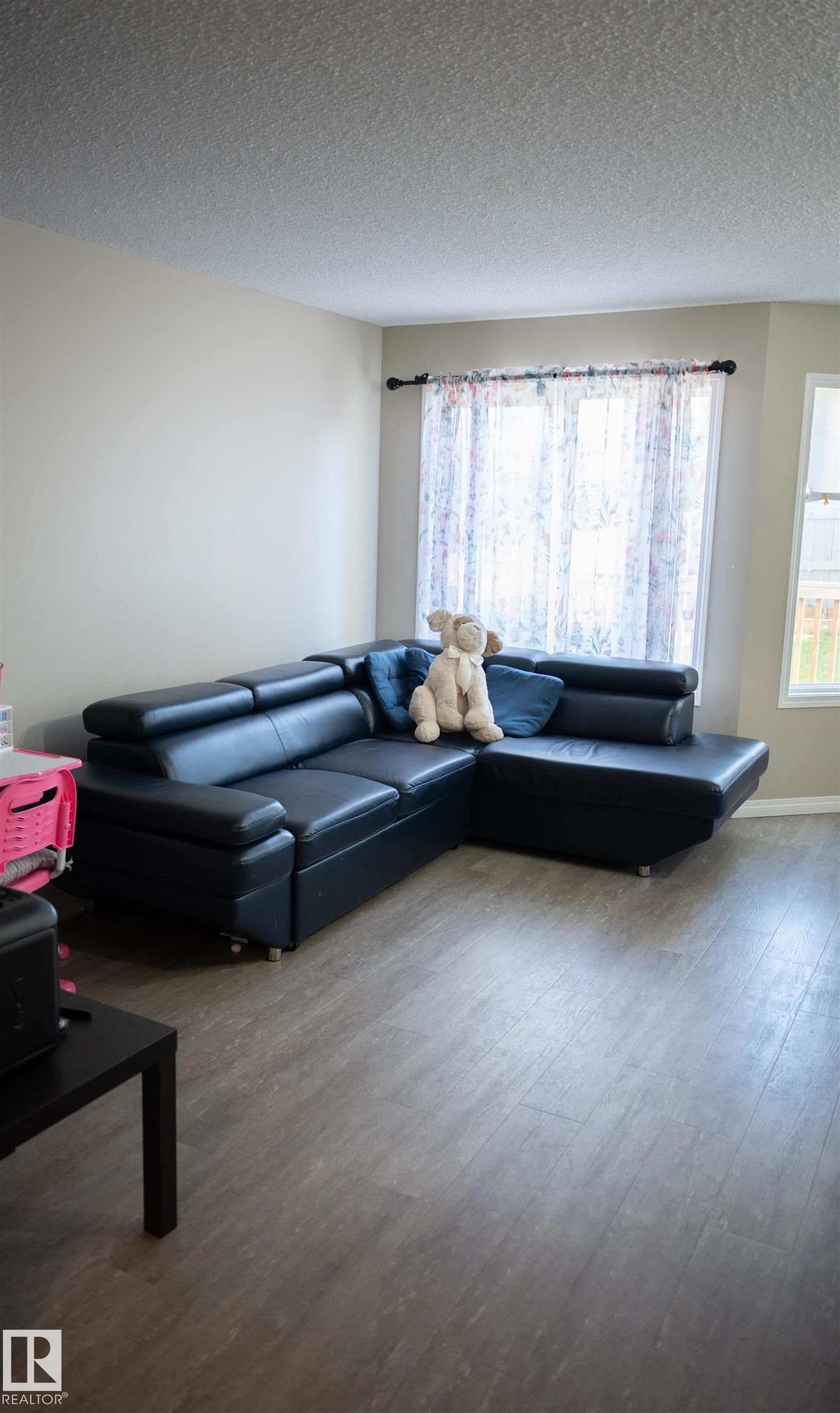 Wood-finish flooring throughout the space - 9014 Cooper Link Link Sw, Edmonton, AB