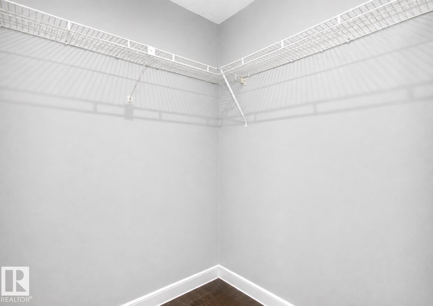 White wire shelving system - #203 2624 Mill Woods Rd E Nw, Edmonton, AB