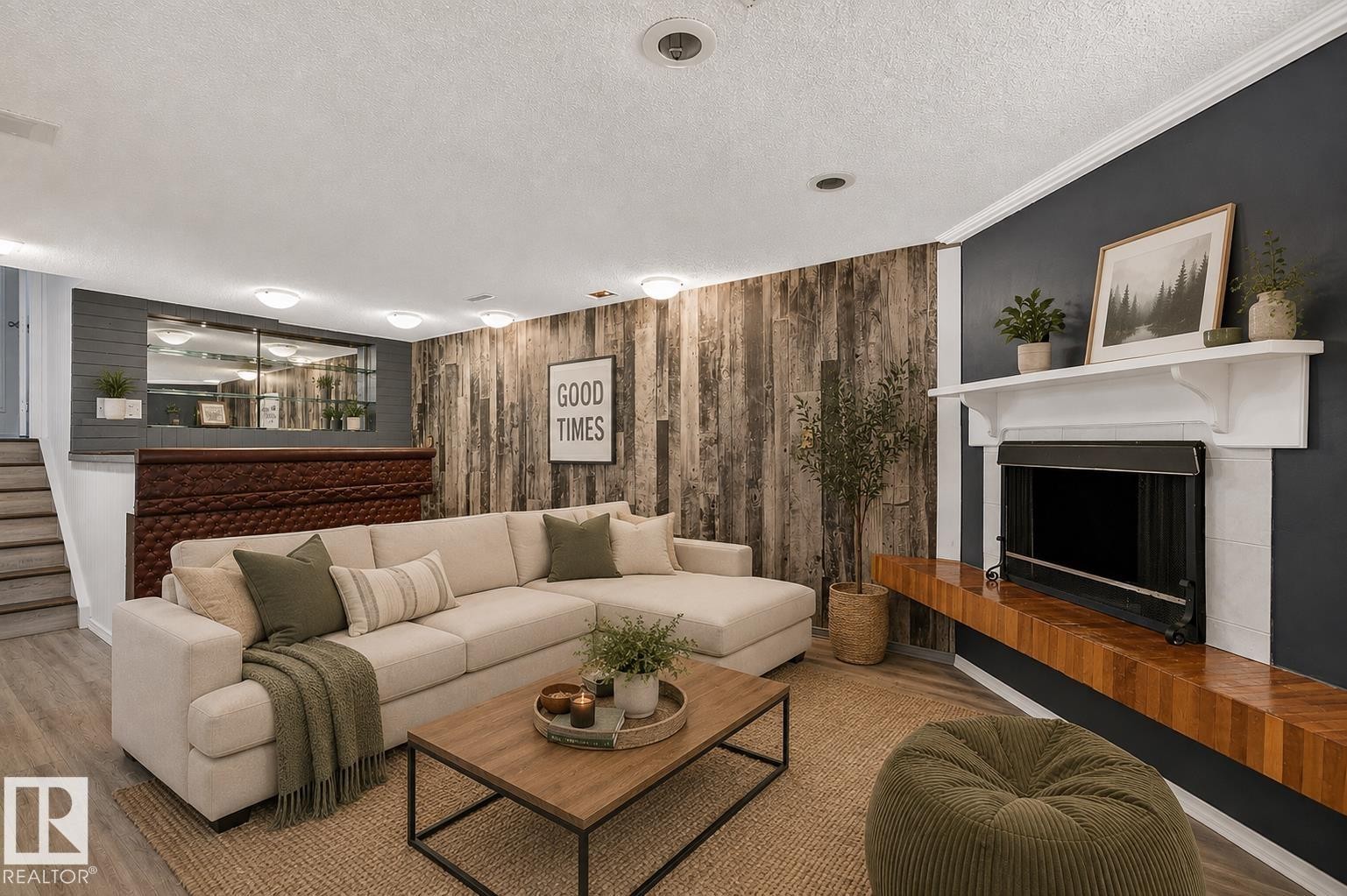Fireplace with a wood mantle, wood-finish accent wall, and recessed lighting - 16016 78A Avenue Nw, Edmonton, AB