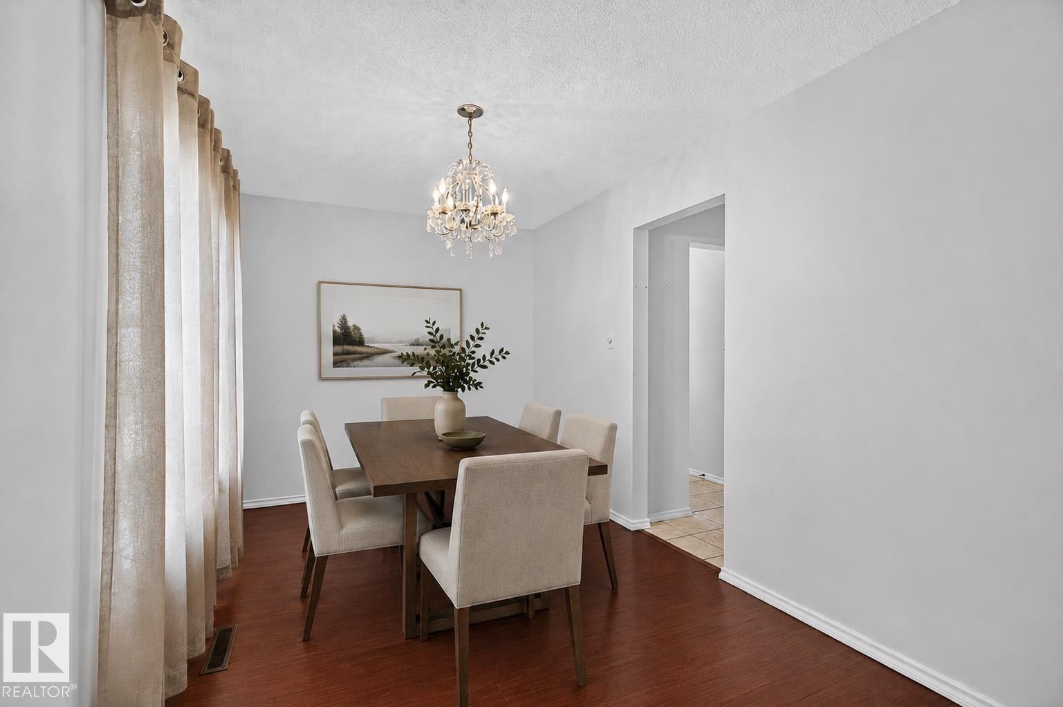 Hardwood-finish flooring, recessed lighting, and an elegant crystal chandelier - 16016 78A Avenue Nw, Edmonton, AB