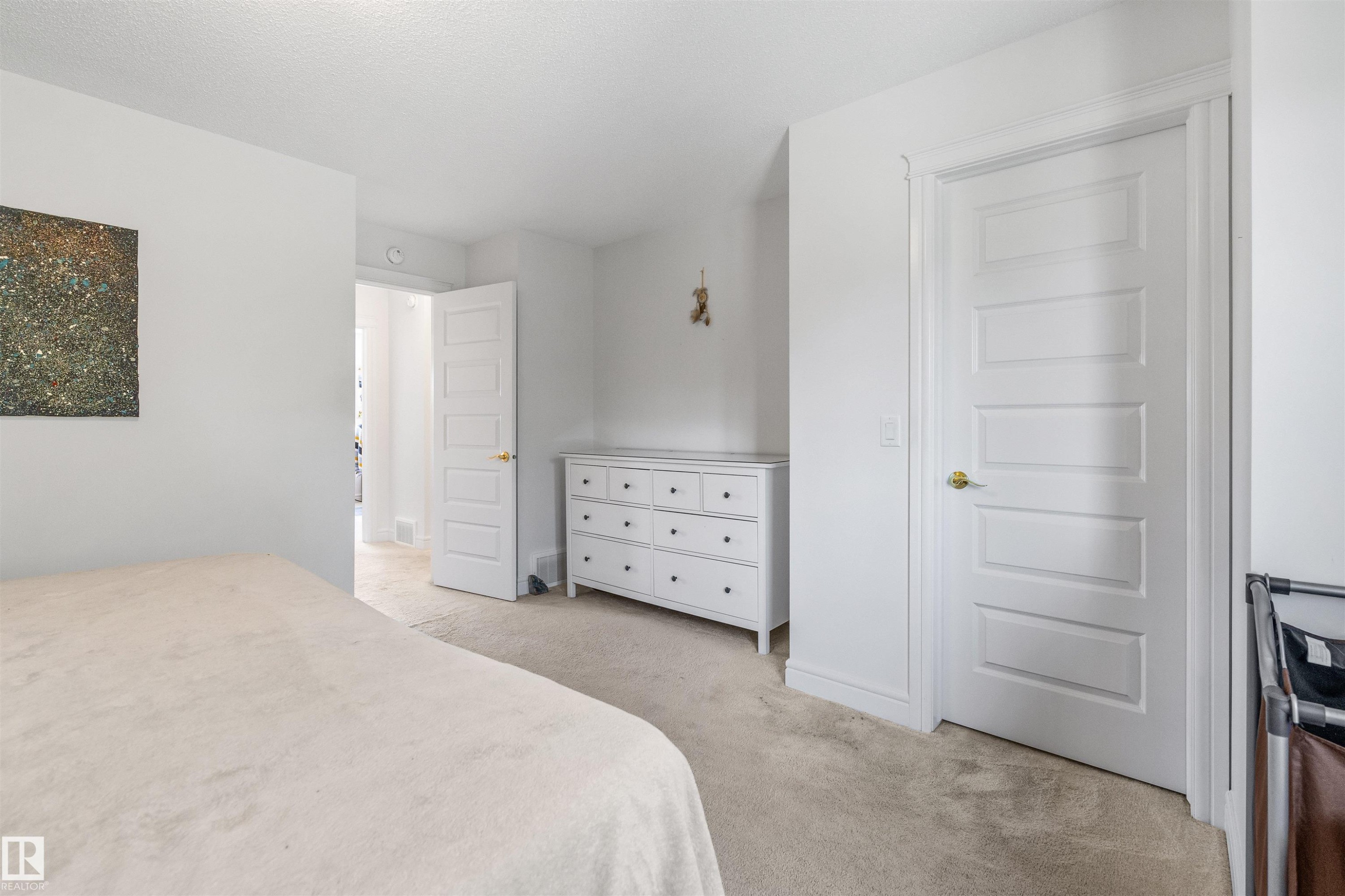 Recessed lighting, light-colored carpeting, white paneled doors, and white trim - #71 330 Bulyea Rd Nw, Edmonton, AB