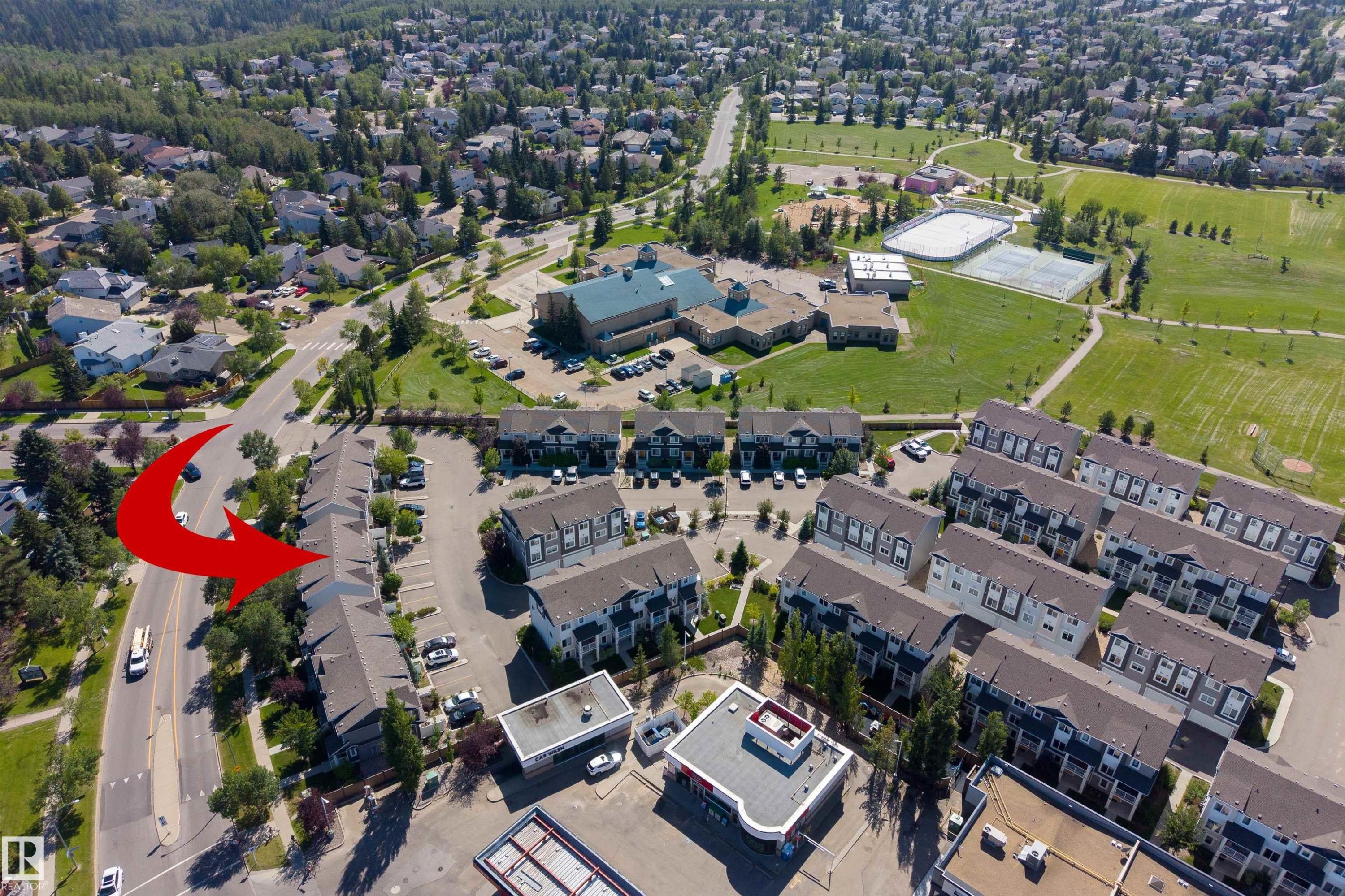 Townhome development with multiple units, ample surface parking, and proximity to a large park area - #71 330 Bulyea Rd Nw, Edmonton, AB