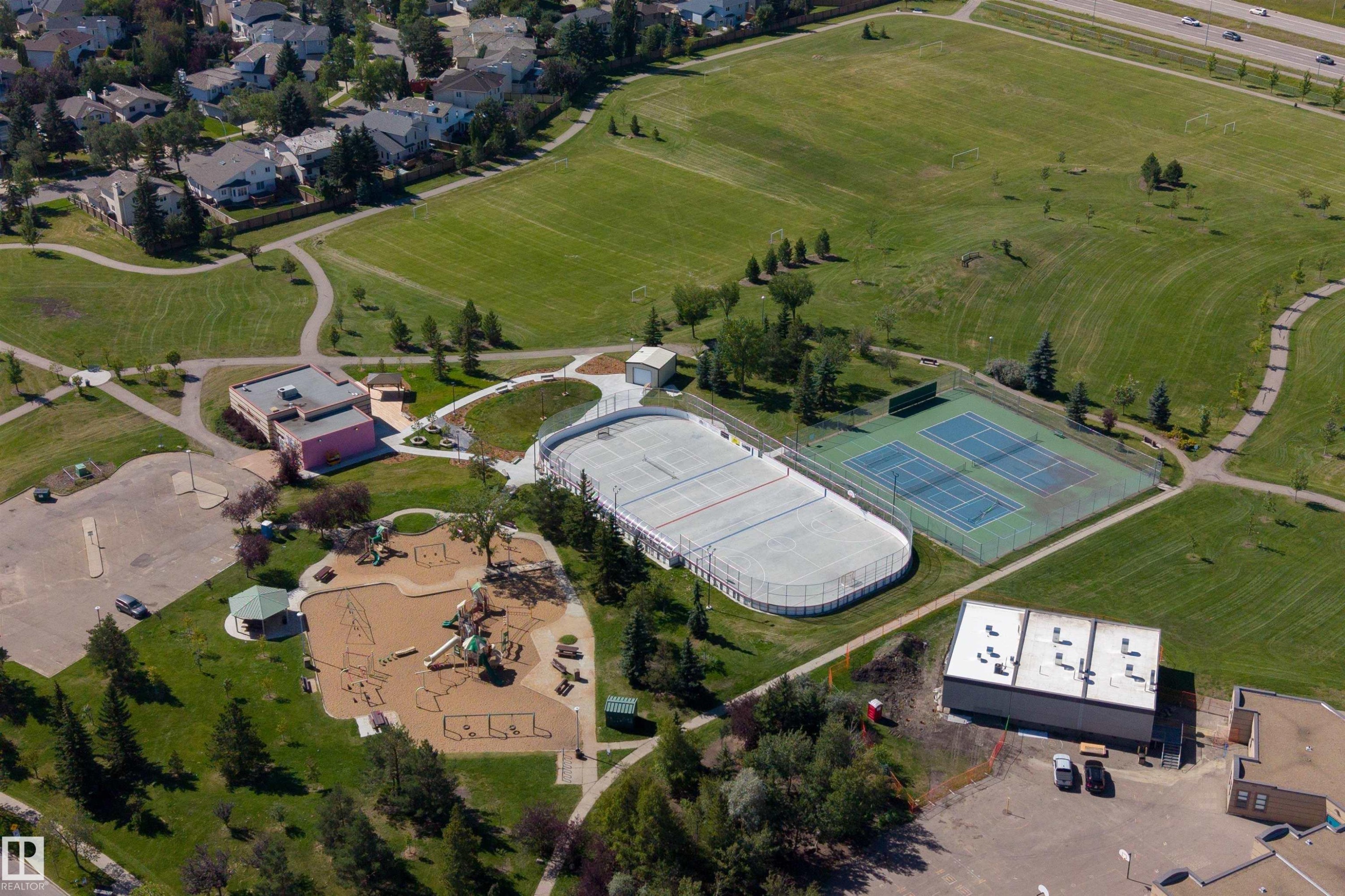 Community amenities featuring a playground, an ice rink, and tennis courts - #71 330 Bulyea Rd Nw, Edmonton, AB