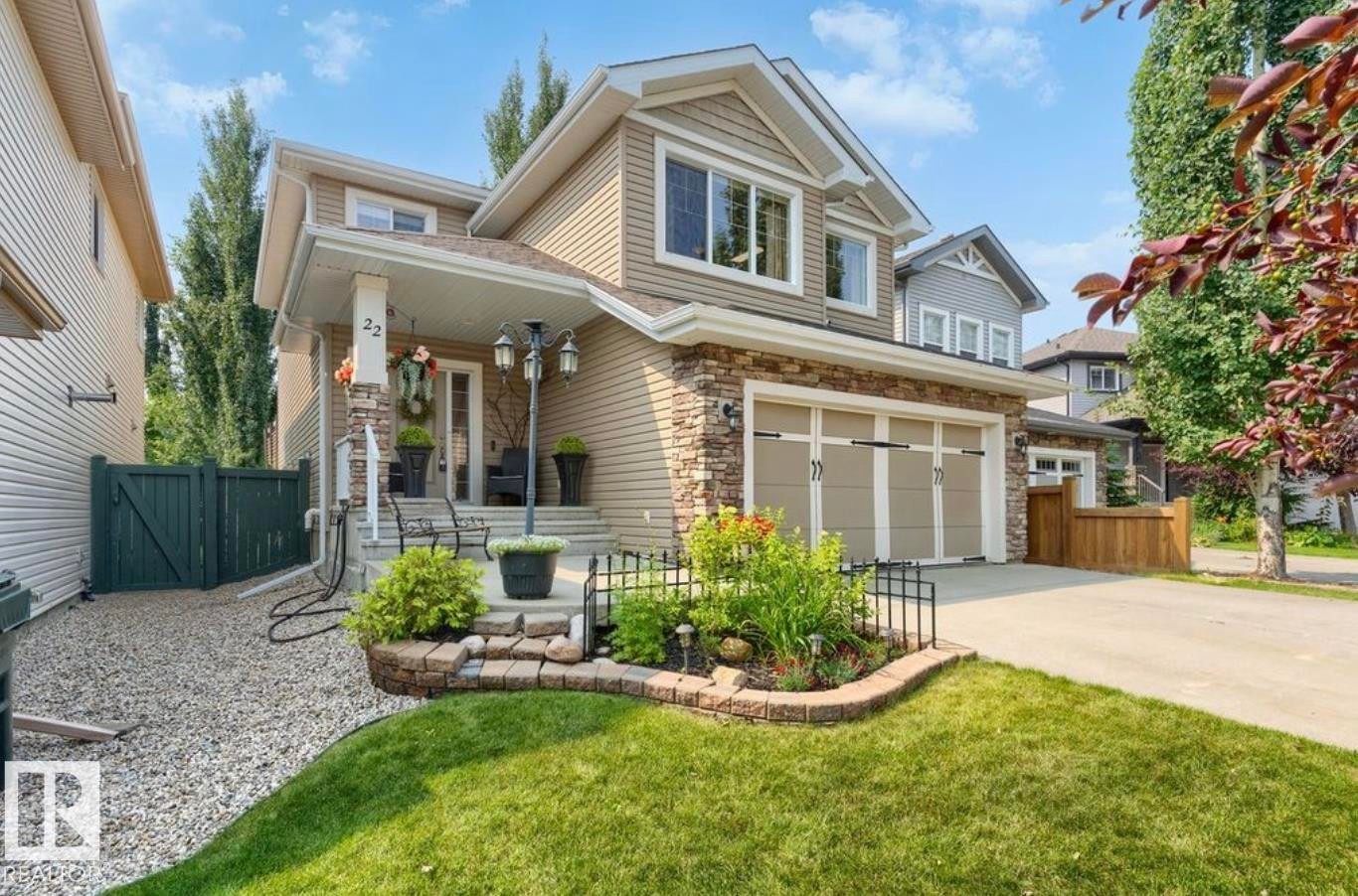 Contemporary two-story exterior featuring siding and stone accents - 22 Voleta Crest, Spruce Grove, AB