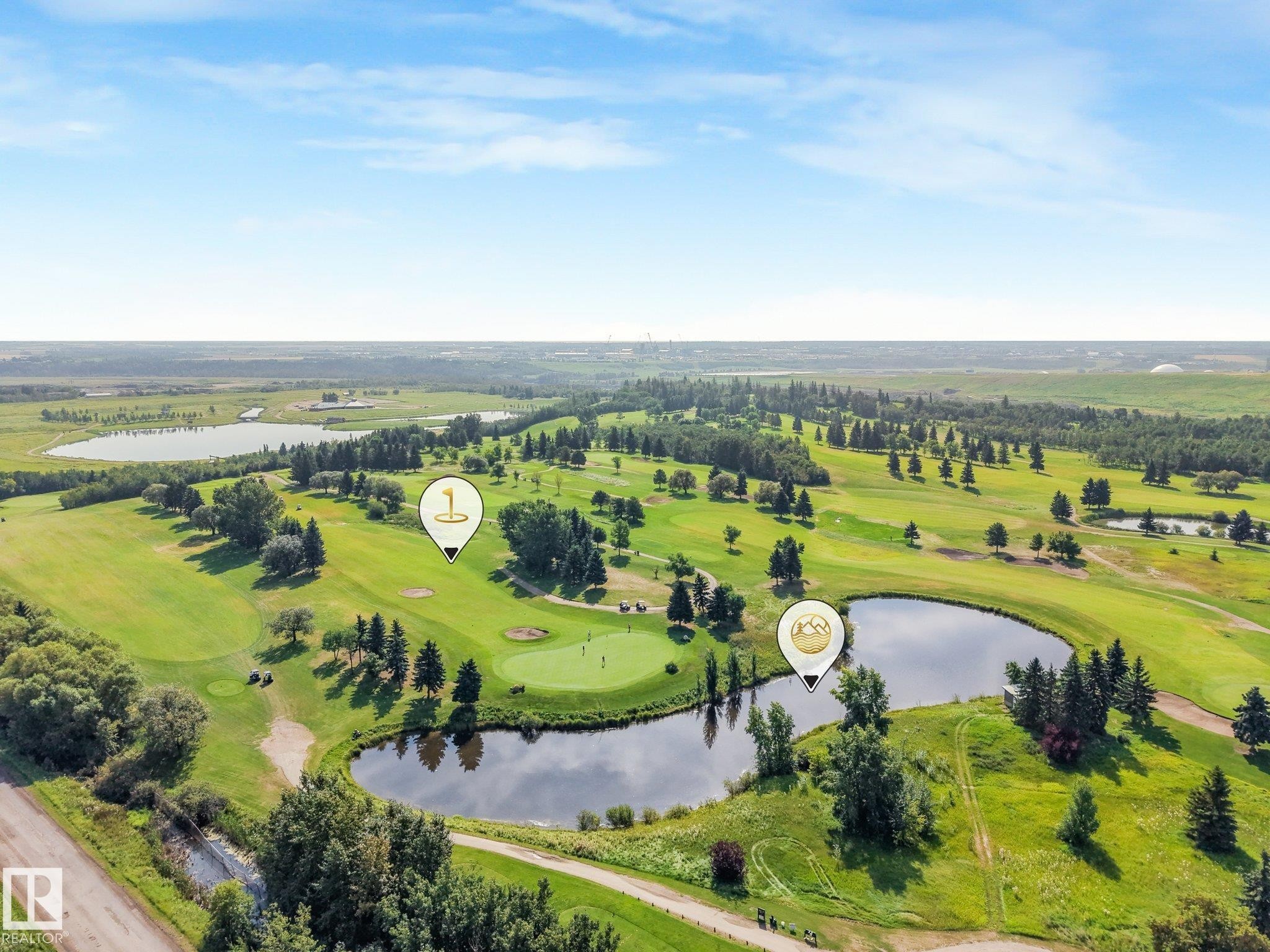 Expansive golf course setting featuring multiple greens, mature trees, and natural water features - 511 157 Avenue Ne, Edmonton, AB