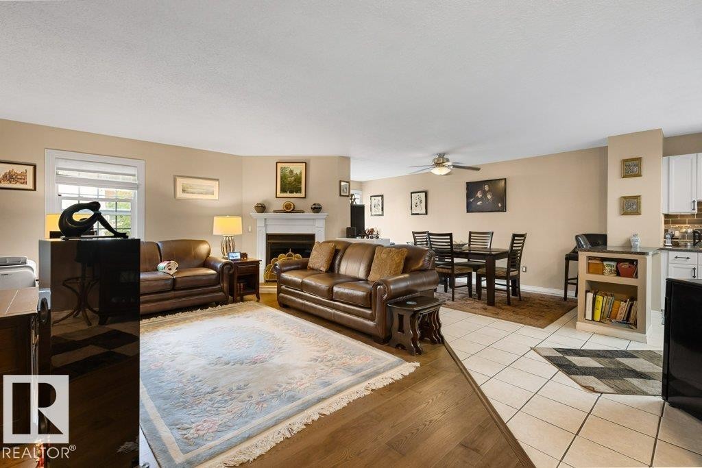 #307 3 Perron St, St. Albert, AB - Indoor Photo Showing Living Room With Fireplace