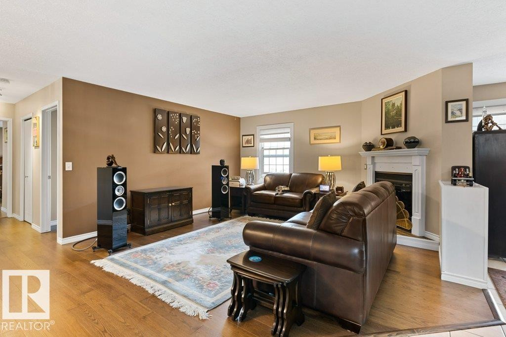 #307 3 Perron St, St. Albert, AB - Indoor Photo Showing Living Room With Fireplace