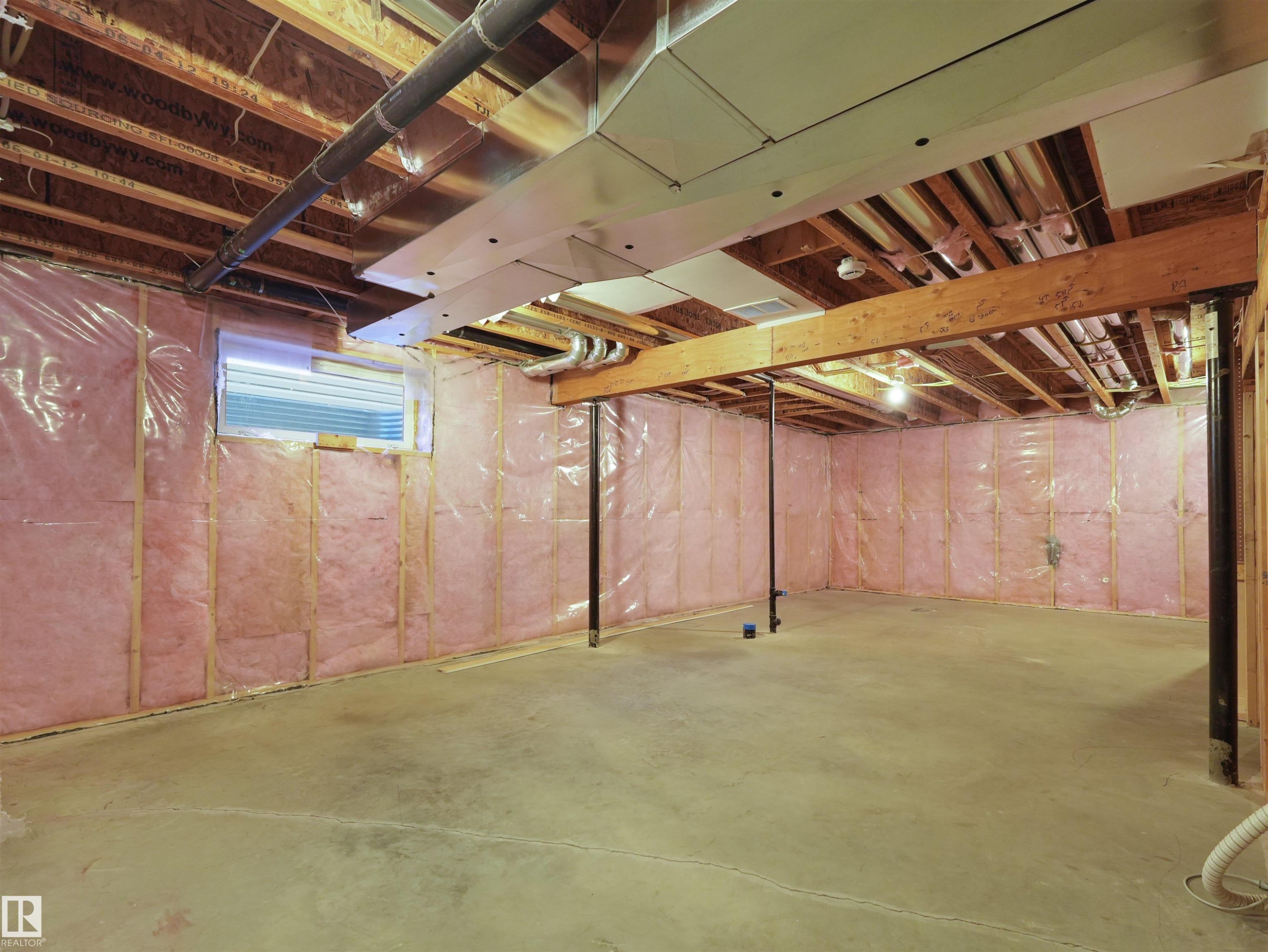 Unfinished basement with concrete flooring, exposed wood joists, and visible insulation - 5190 1B Avenue Sw, Edmonton, AB