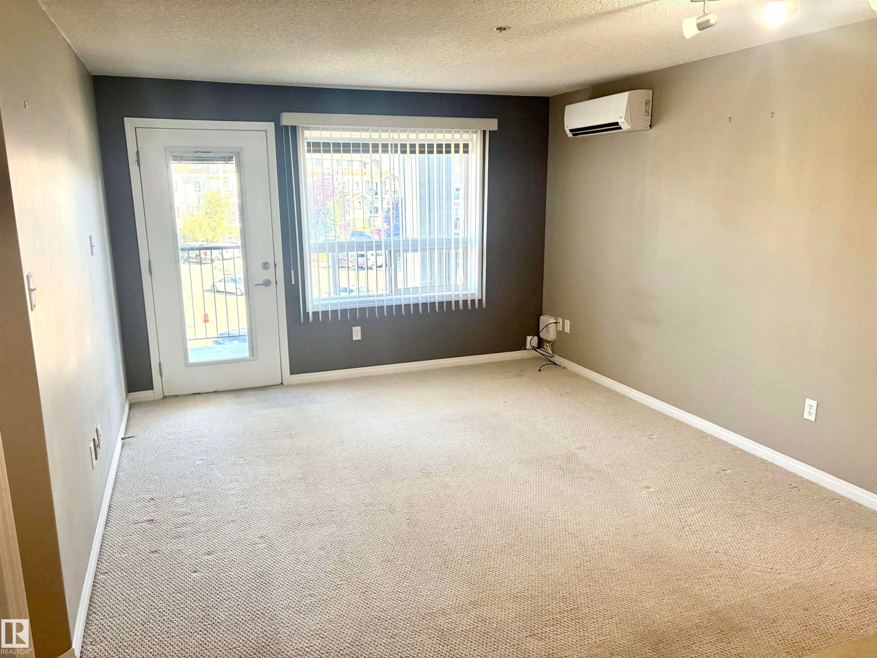 Room featuring carpeted flooring and track lighting - #1304 9363 Simpson Dr Nw, Edmonton, AB