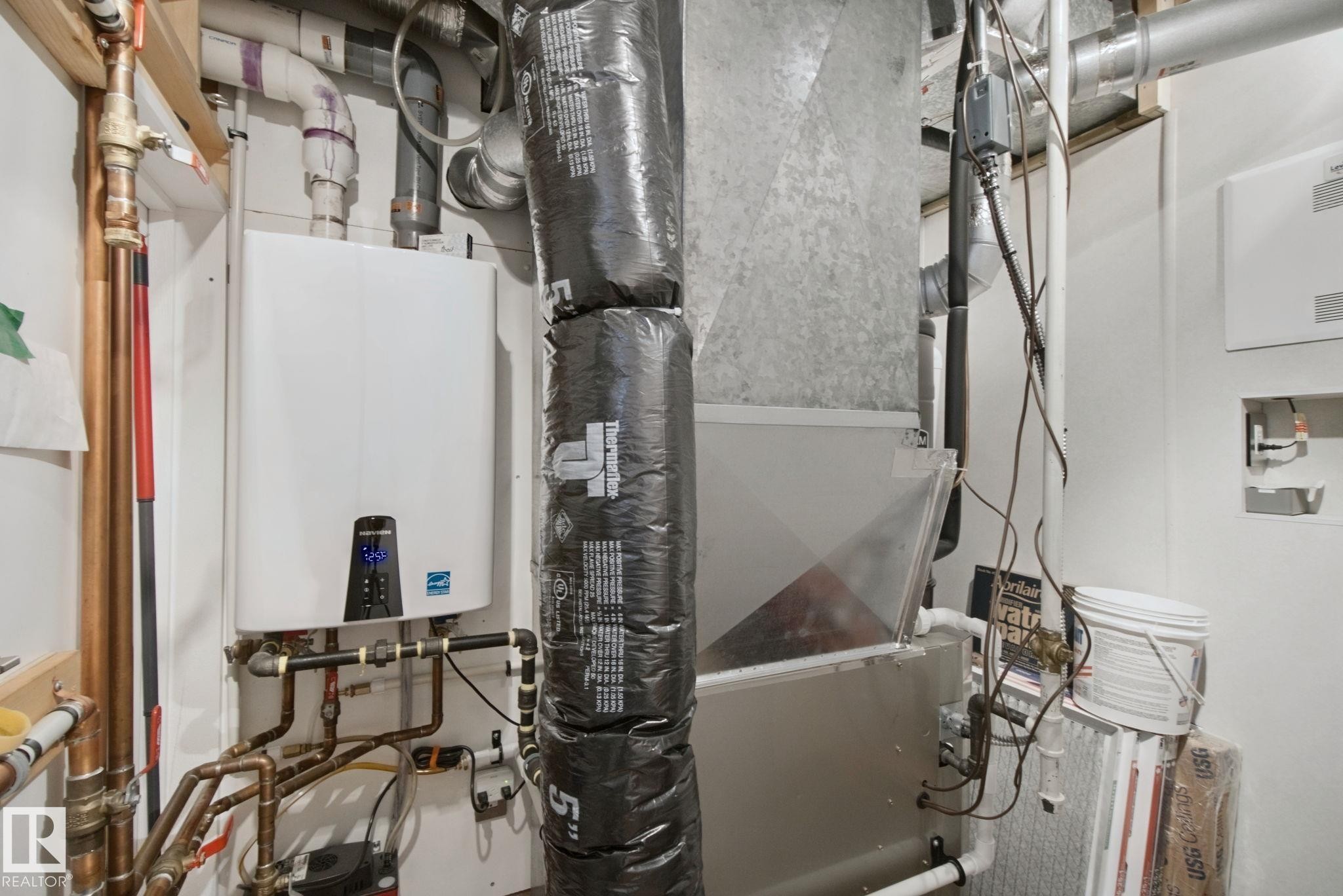 Energy-efficient tankless water heater, copper piping, and a forced-air HVAC system - 12916 63 Street Nw, Edmonton, AB