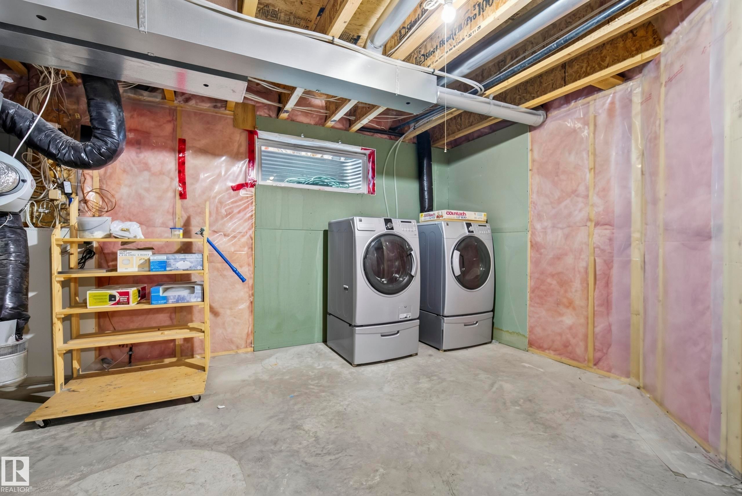 Concrete flooring with exposed ceiling joists - 15213 49A Street Nw, Edmonton, AB
