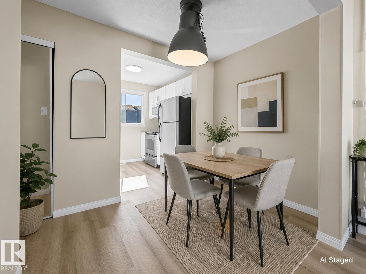 Wood-finish flooring throughout the dining area - 141 Dickinsfield Court Nw, Edmonton, AB