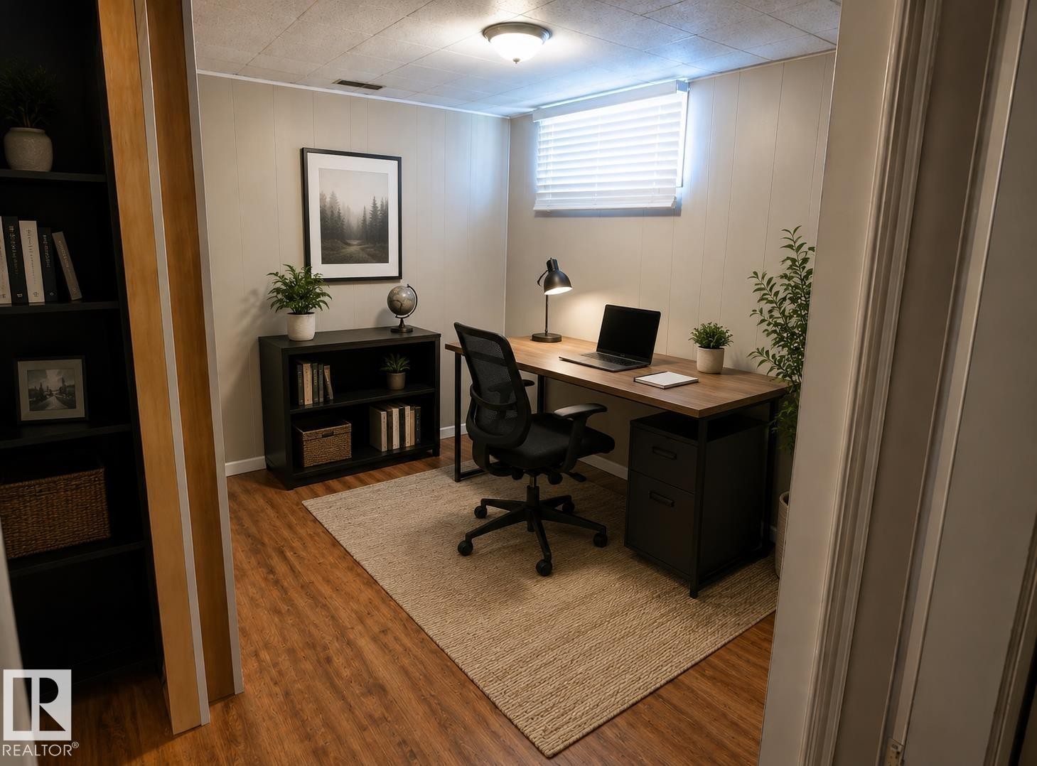 Recessed lighting, wood-finish flooring, and white paneling on perimeter walls - 10439 36A Ave Nw, Edmonton, AB