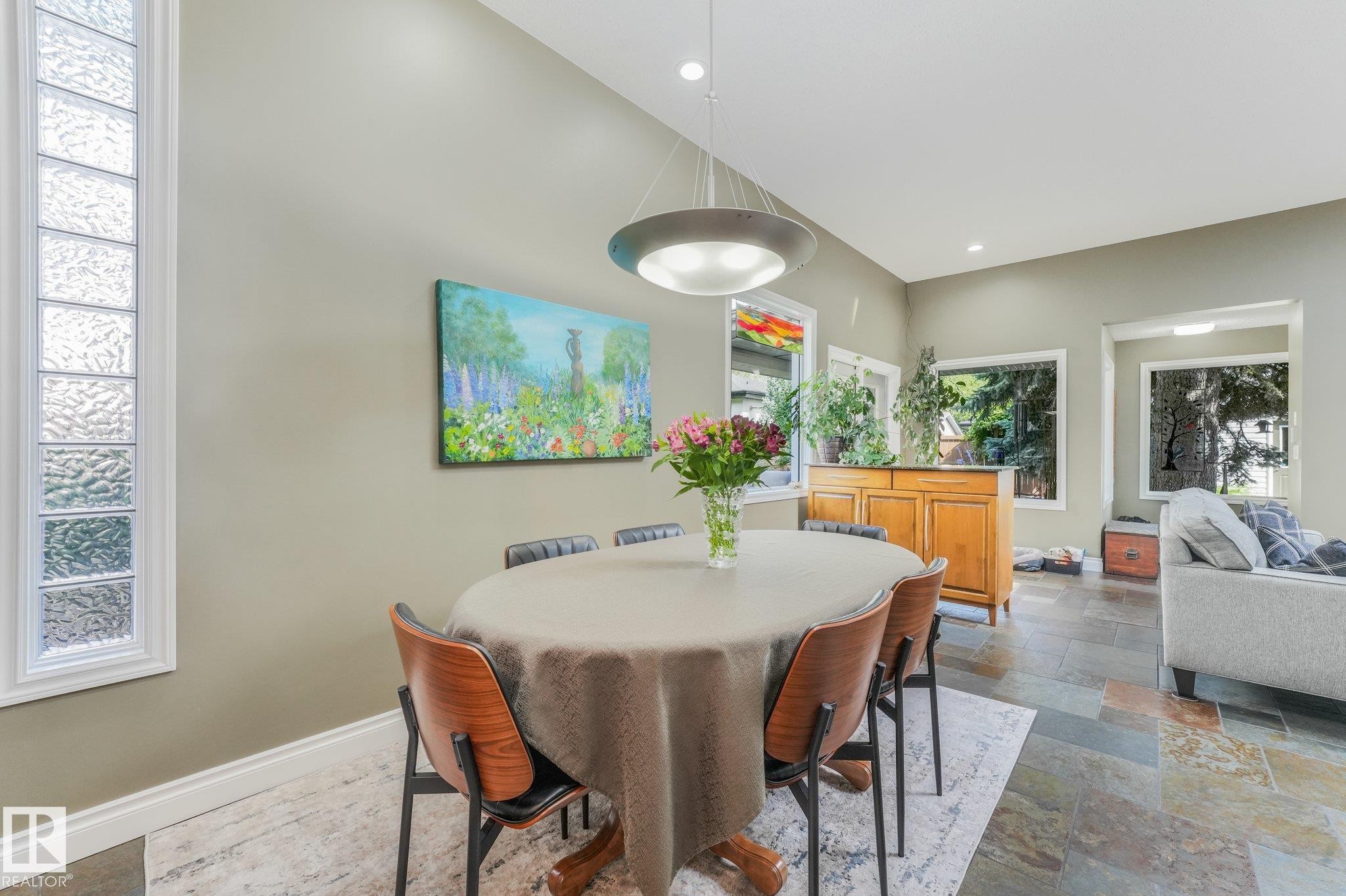 Vaulted ceiling with recessed lighting, multi-pane glass block window, slate flooring & large dining room space. - 10531 137 Street Nw, Edmonton, AB