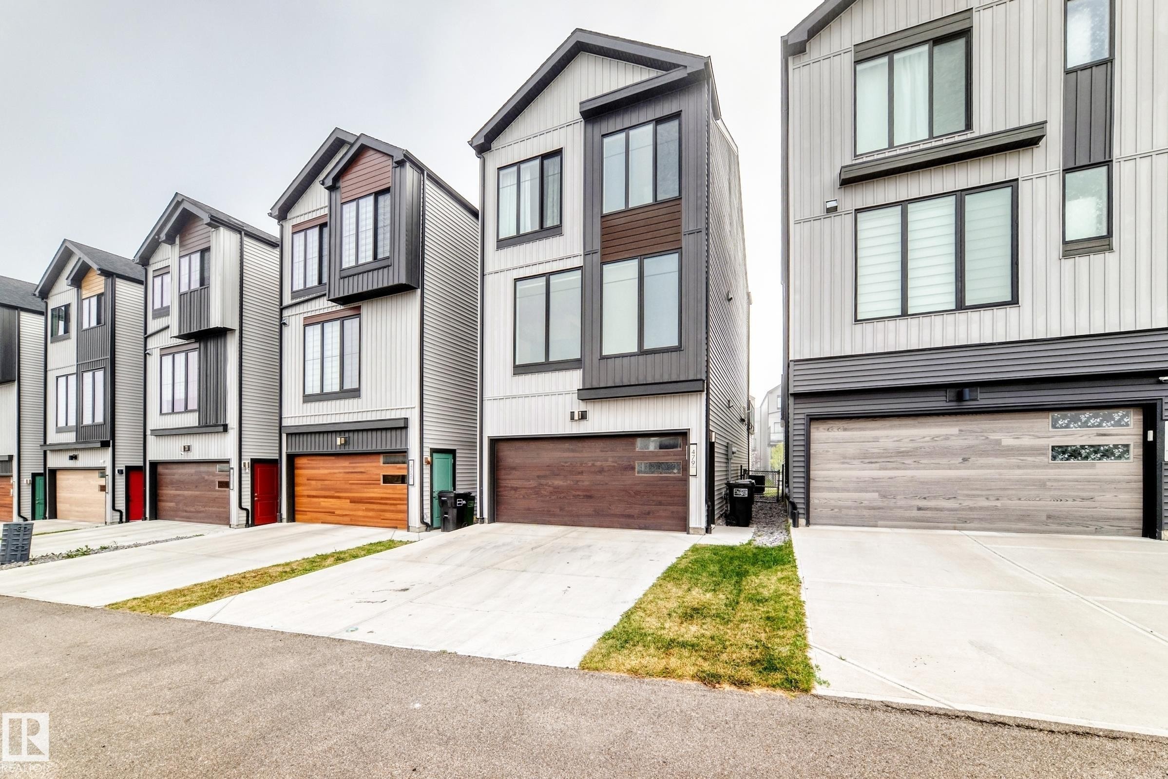 Modern architectural style featuring vertical siding and dark accents - 479 39 St Sw, Edmonton, AB
