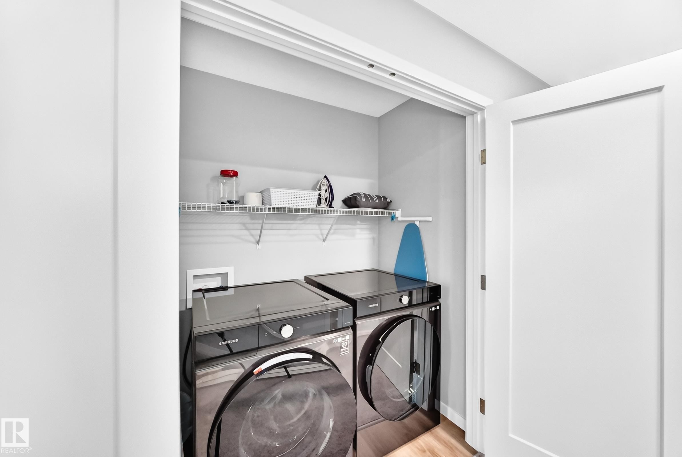 Dedicated laundry closet with shelving - 479 39 St Sw, Edmonton, AB