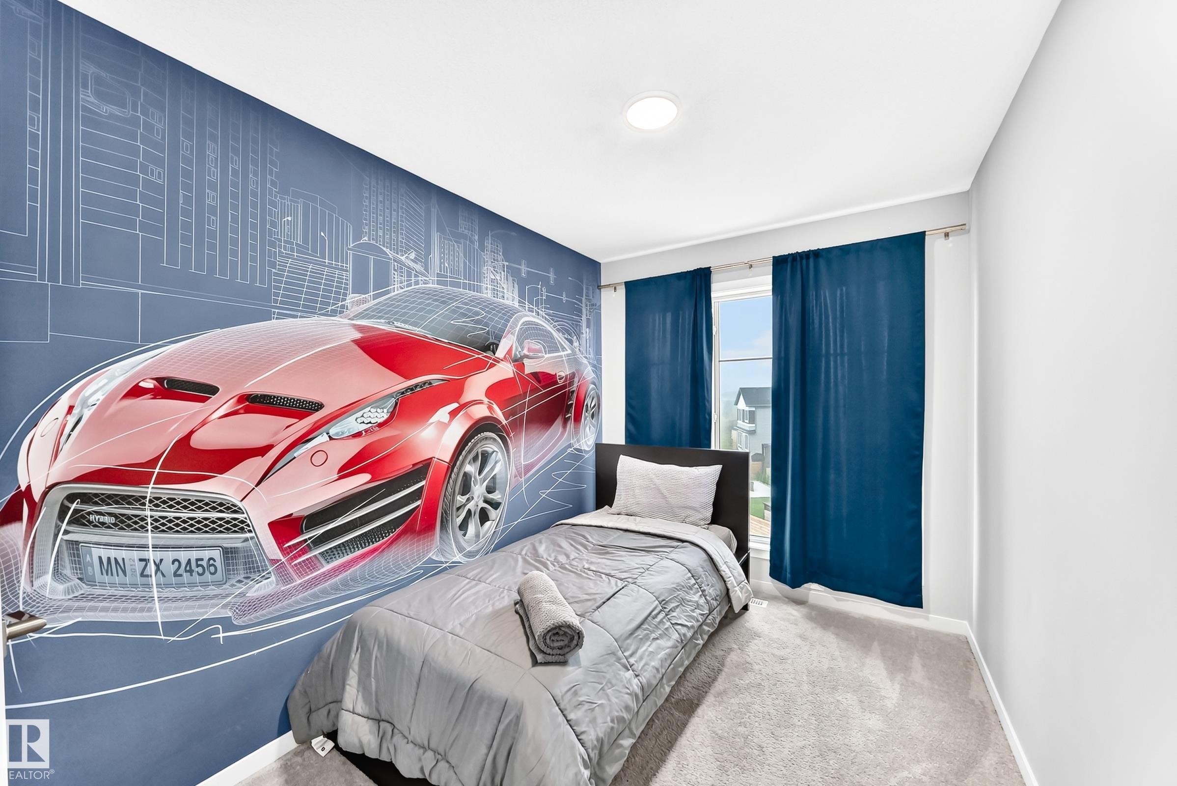 Accent wall featuring a detailed car graphic - 479 39 St Sw, Edmonton, AB