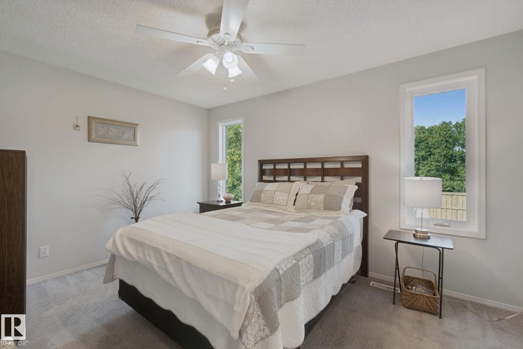 Carpeted flooring, white walls, and a ceiling fan with light fixture - 15618 141 Street Nw, Edmonton, AB