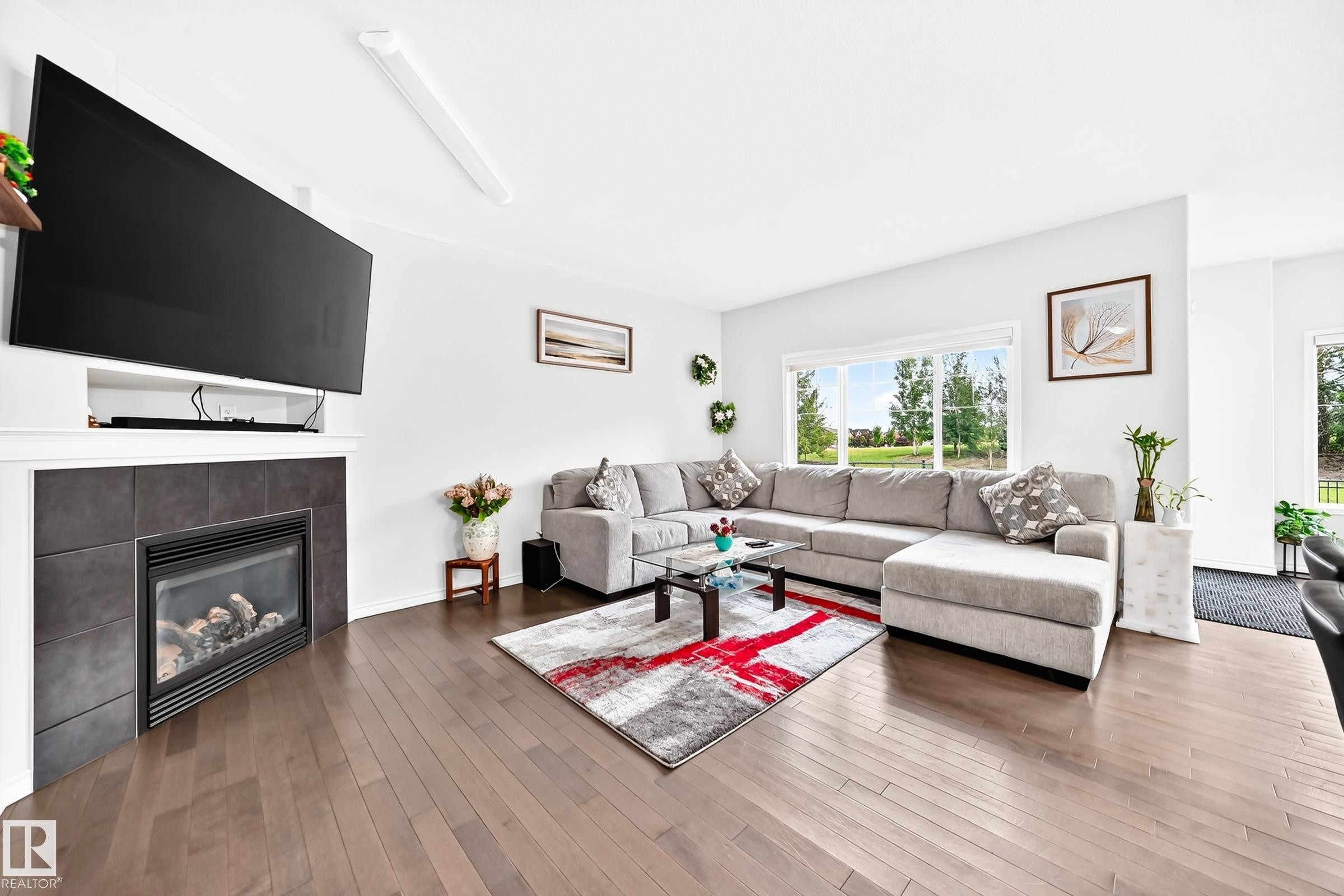 Hardwood-style flooring throughout - 2015 Chalmers Way Sw, Edmonton, AB