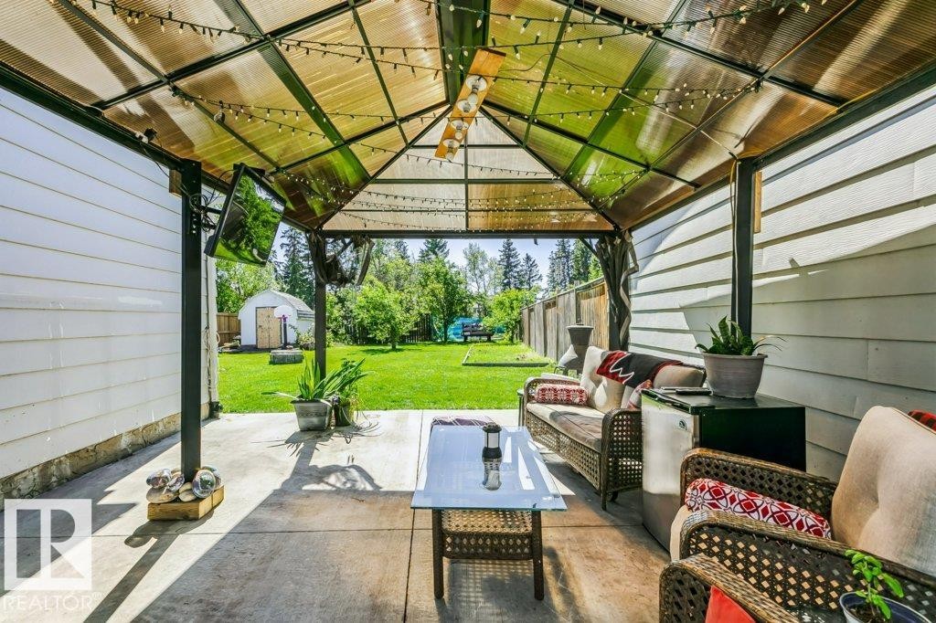 Covered patio with durable concrete flooring - 18431 95A Avenue Nw, Edmonton, AB
