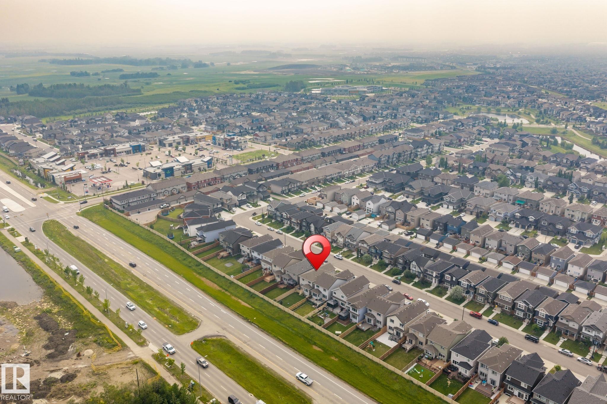 Aerial view showcasing a residential neighborhood with varied housing styles - 2131 51 Sw, Edmonton, AB - Outdoor With View