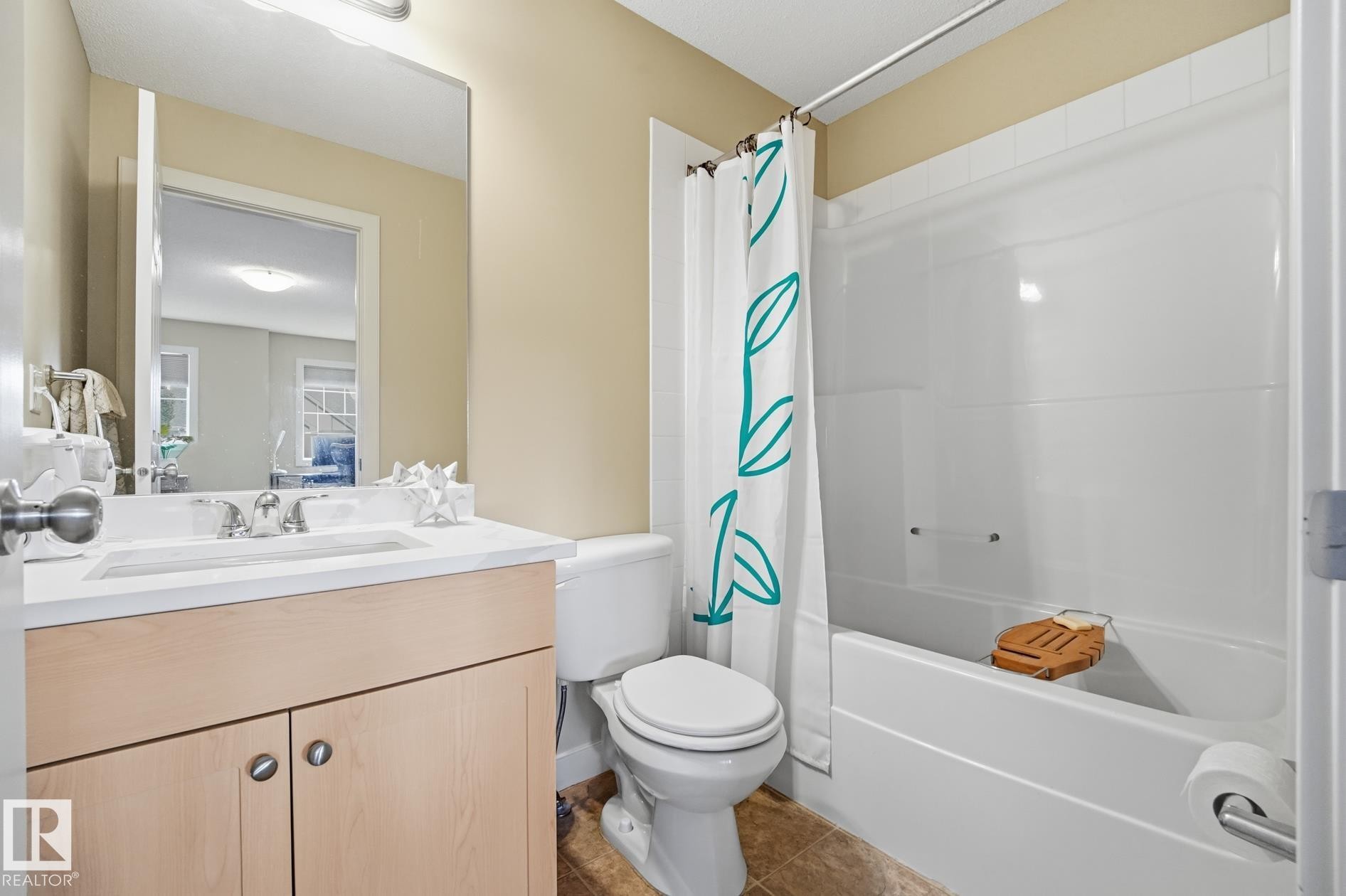 Vanity with integrated sink, wood-finish cabinetry, and brushed nickel hardware - 20007 131 Avenue Nw, Edmonton, AB